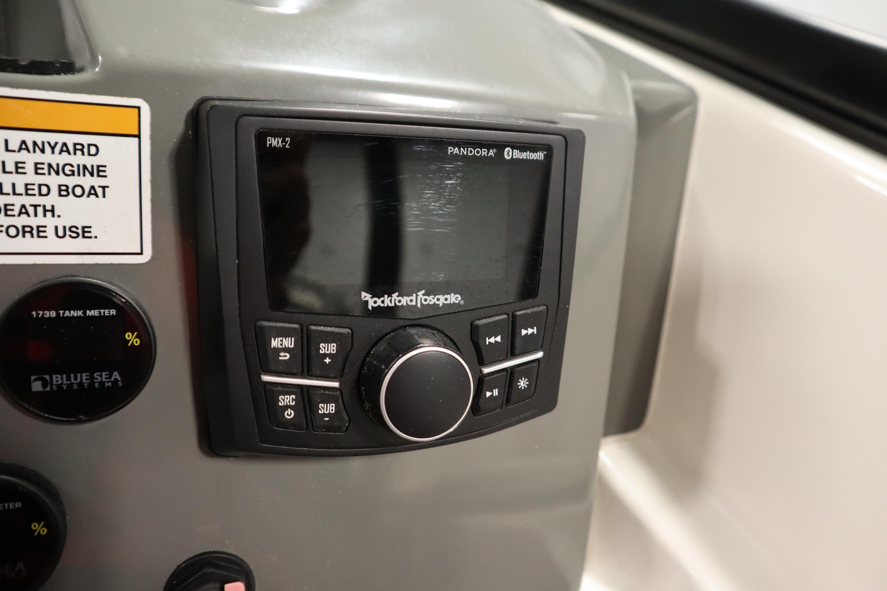 2023 Heyday WT Surf boat dashboard with Rockford Fosgate audio system and control panel.