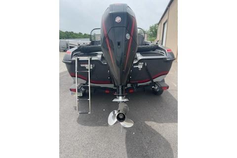 2023 Nitro ZV19 Sport boat rear view with outboard motor and ladder.
