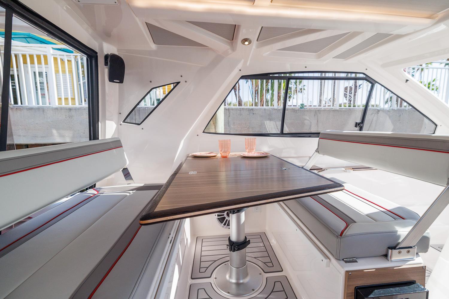 Interior of 2026 Solara S-310 SB boat with modern seating and table setup.