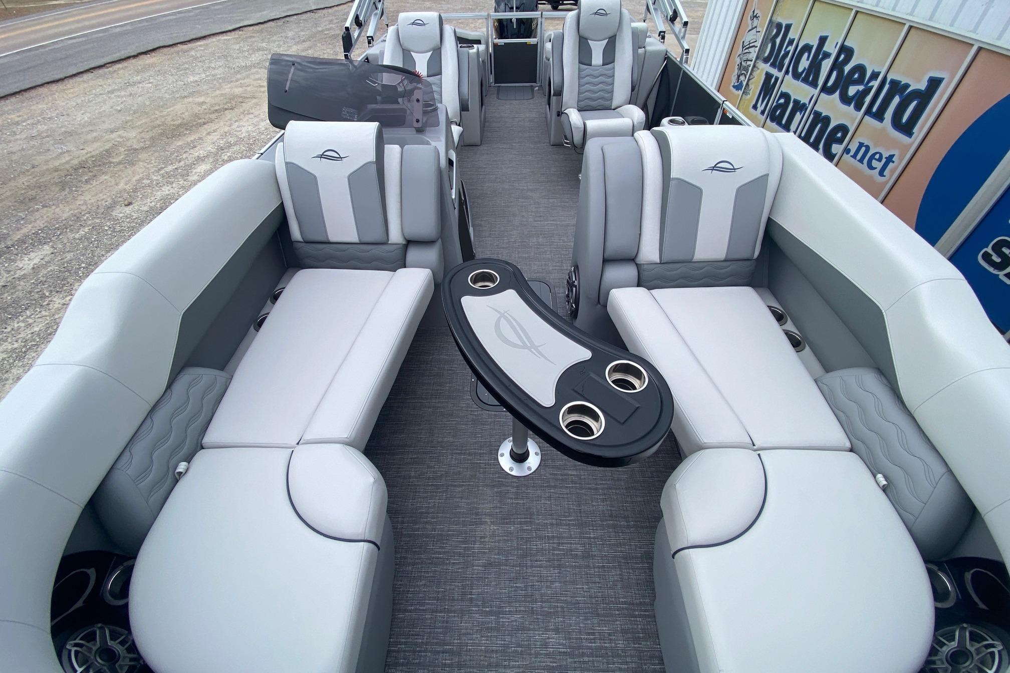 Luxurious interior of 2026 SunCatcher Diamond Elite 324 SS pontoon boat with plush seating.