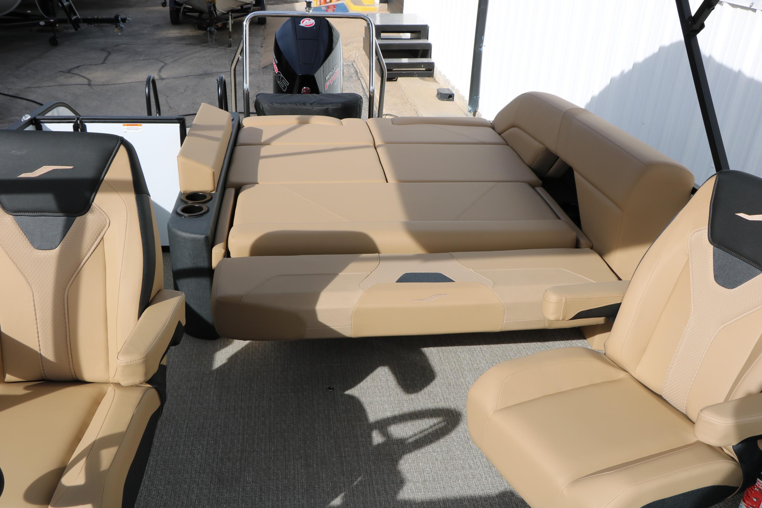 Luxurious seating on 2026 Evotti 523CS boat, featuring beige and black upholstery.