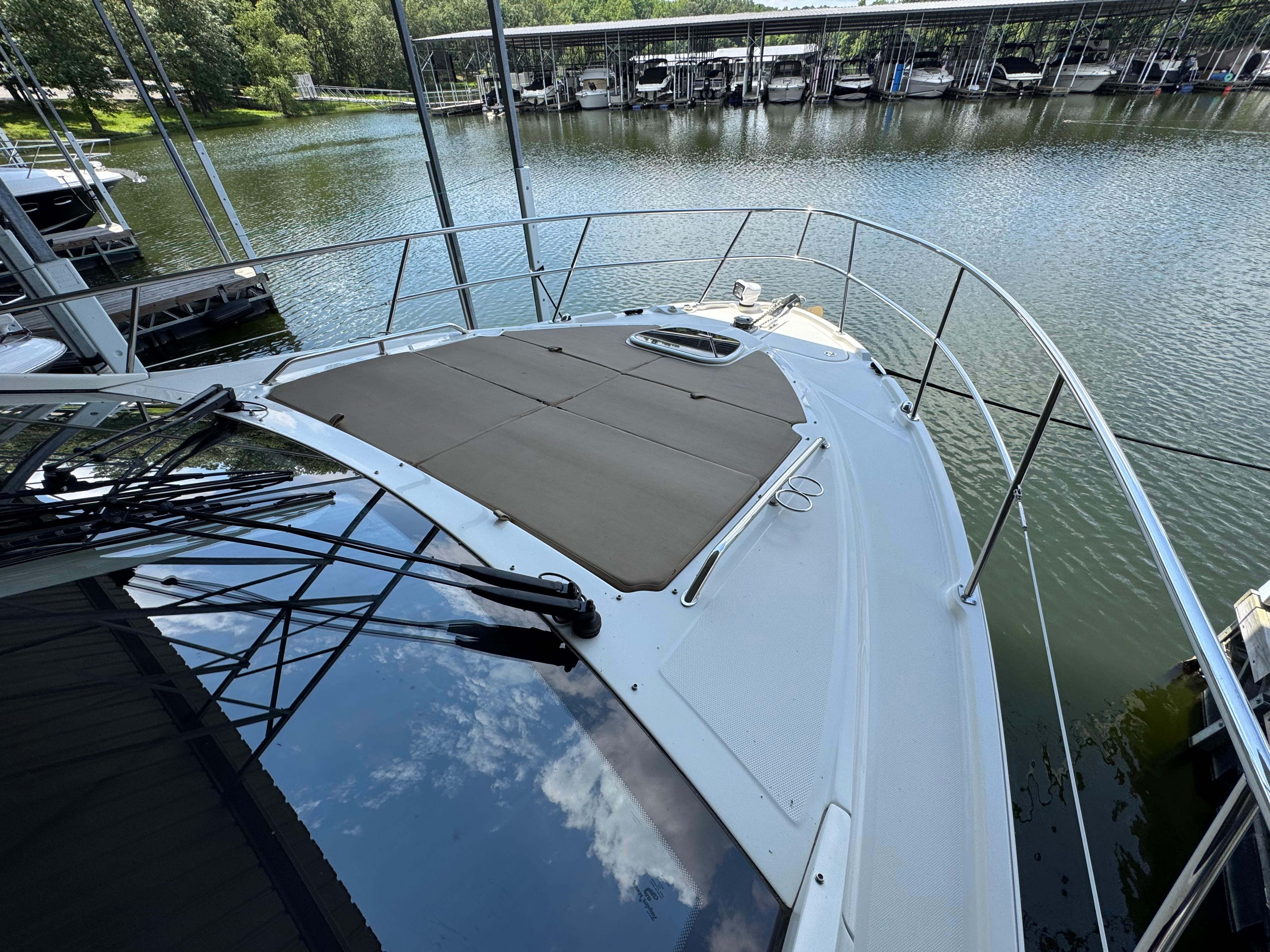 2017 Sea Ray Sundancer 400 yacht docked by a serene marina.
