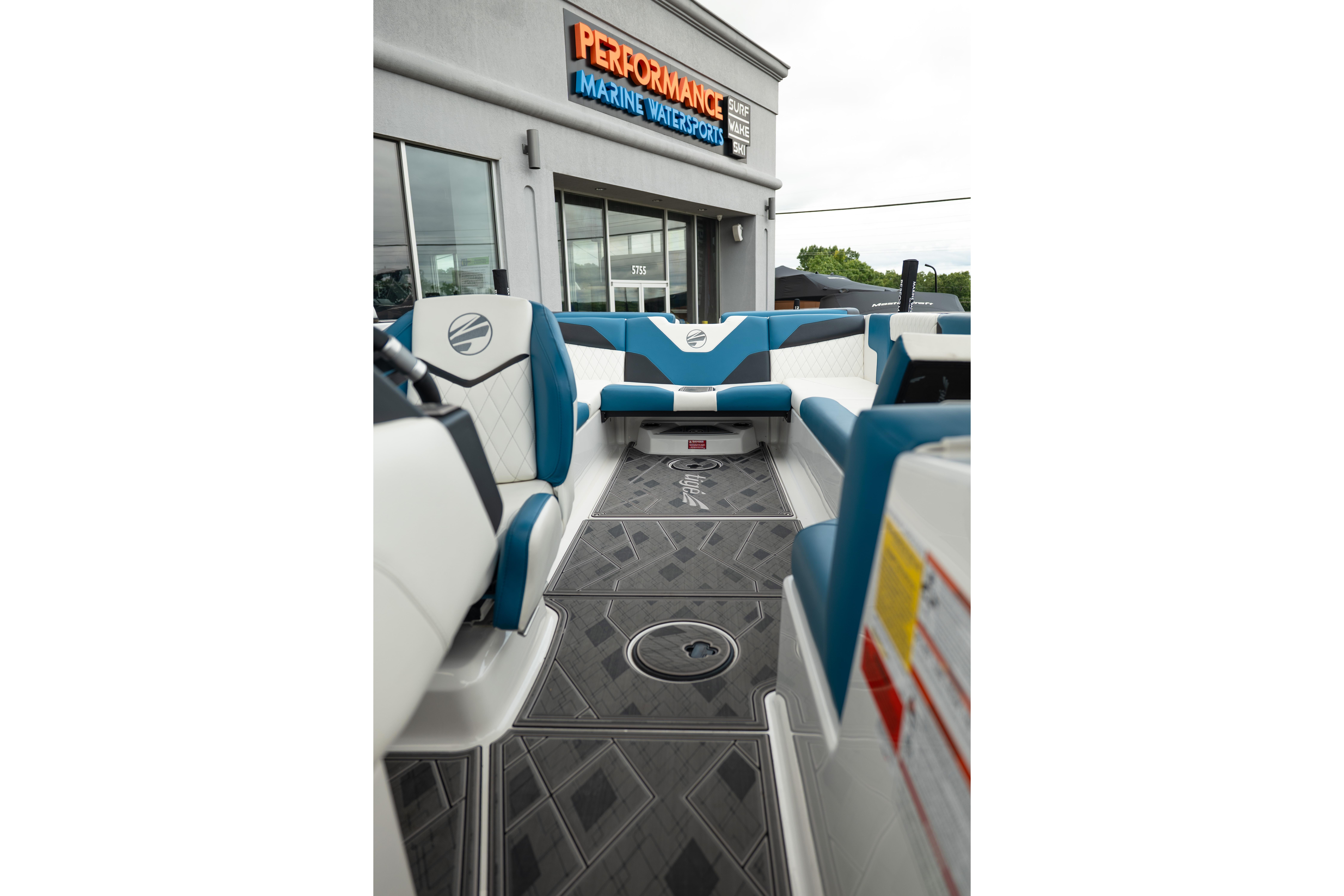 2024 Tigé Z5 boat interior with blue and white seating at Performance Marine Watersports.