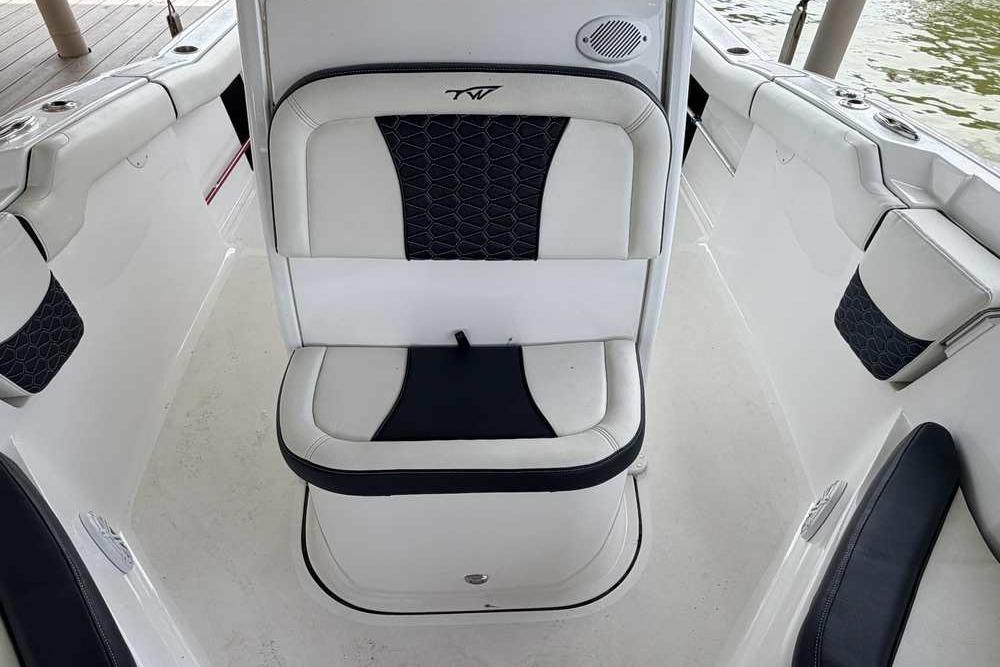 2024 Tidewater 232 LXF boat interior with cushioned seating and sleek design.