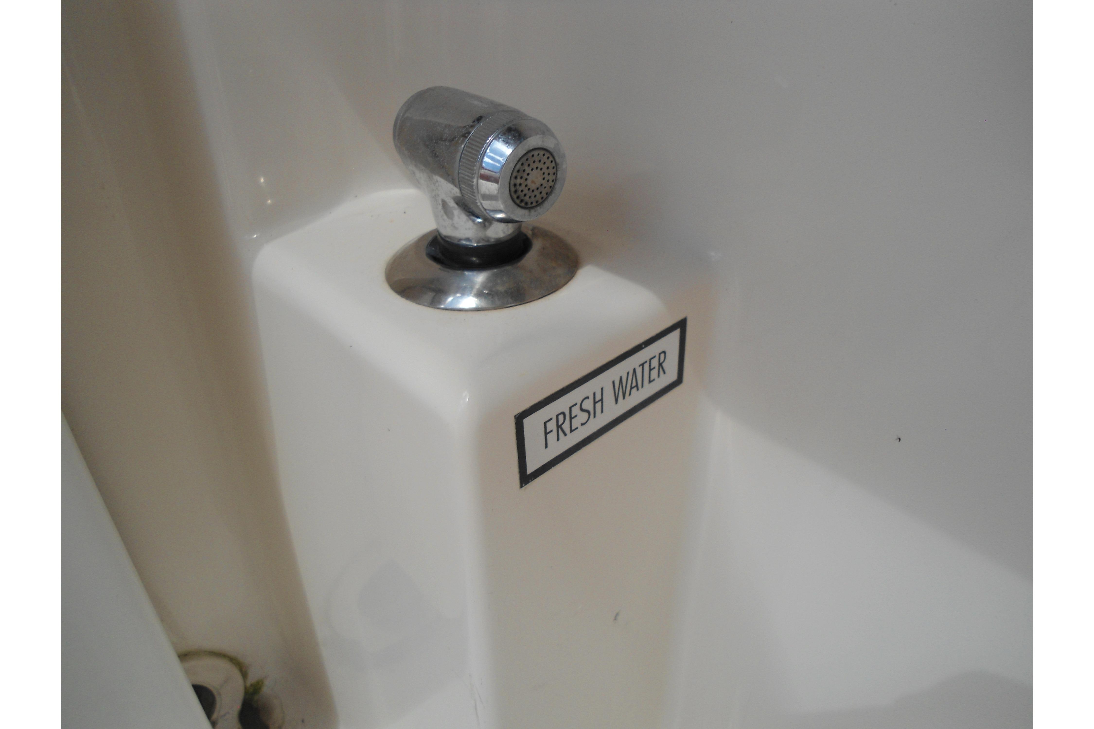 Fresh water faucet on 2013 Pursuit C 260 Center Console boat.