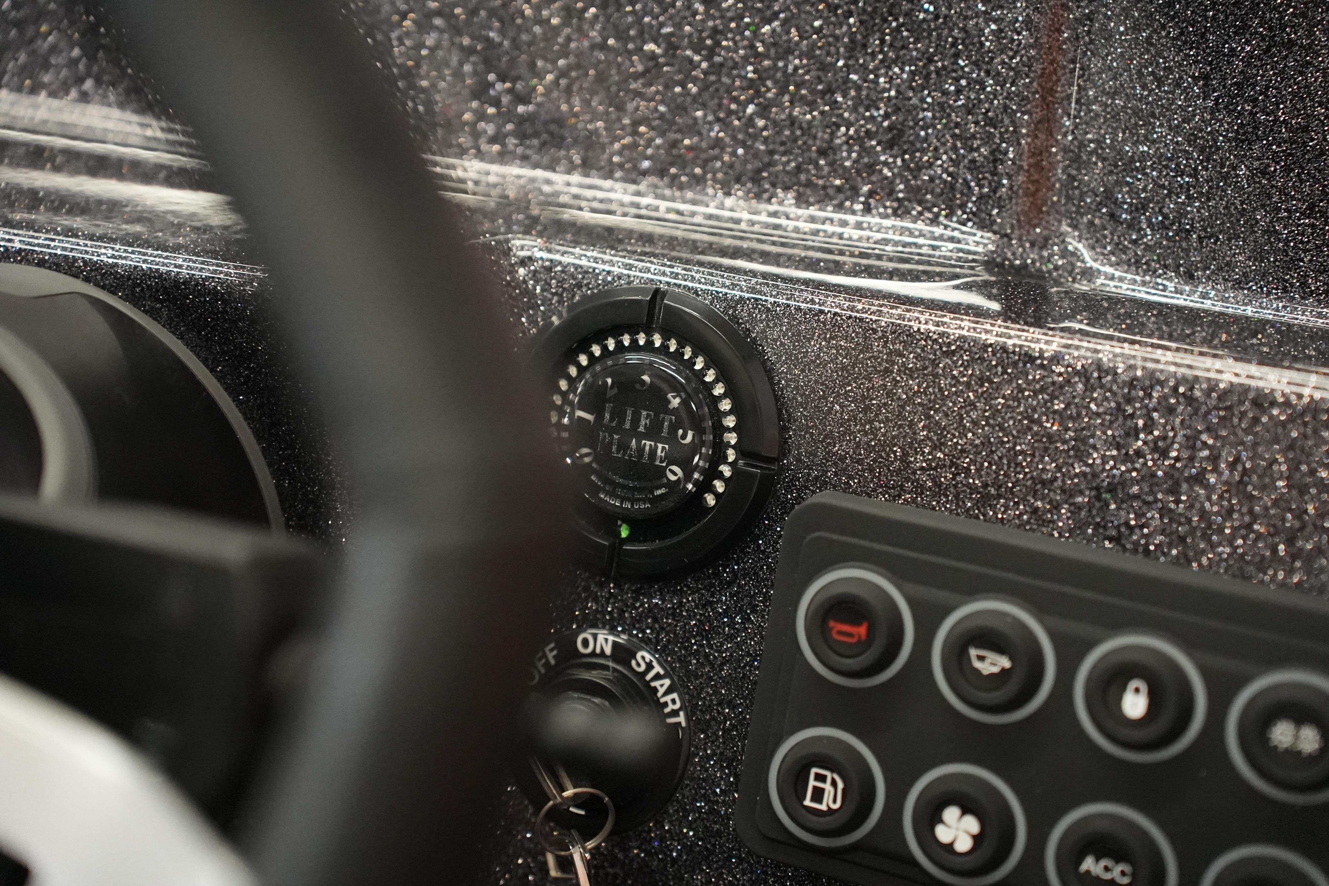 2026 Bass Cat Puma STS dashboard with lift plate control and ignition key.