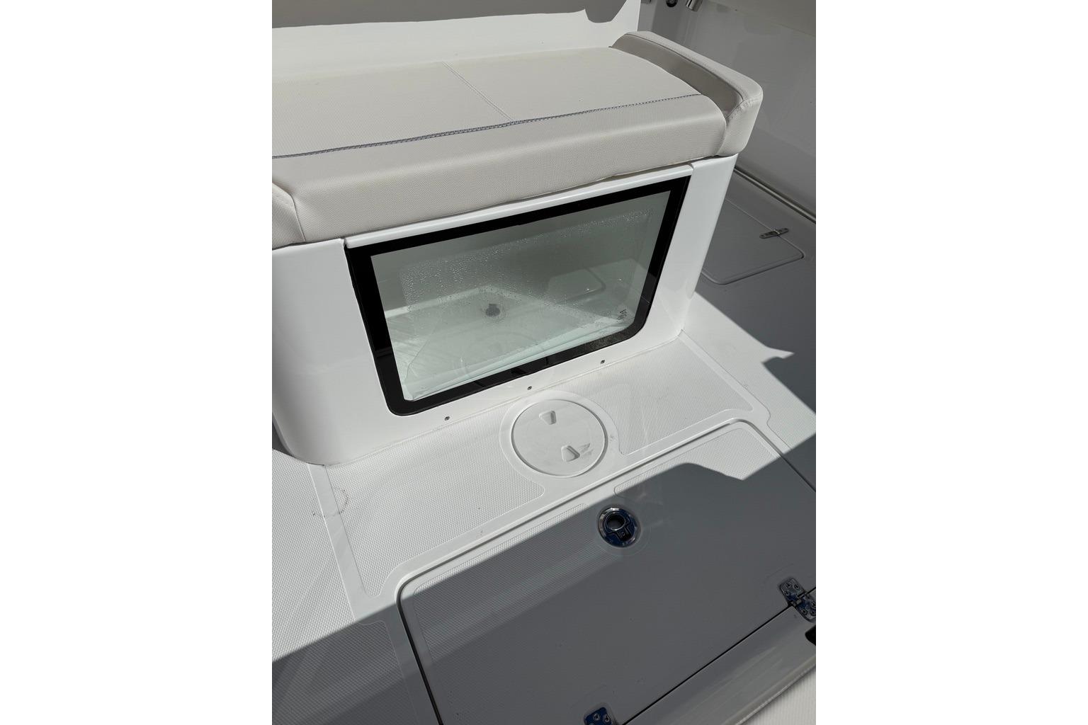 2026 Sea Hunt Ultra 285 Coffin Box interior with seating and storage compartment.