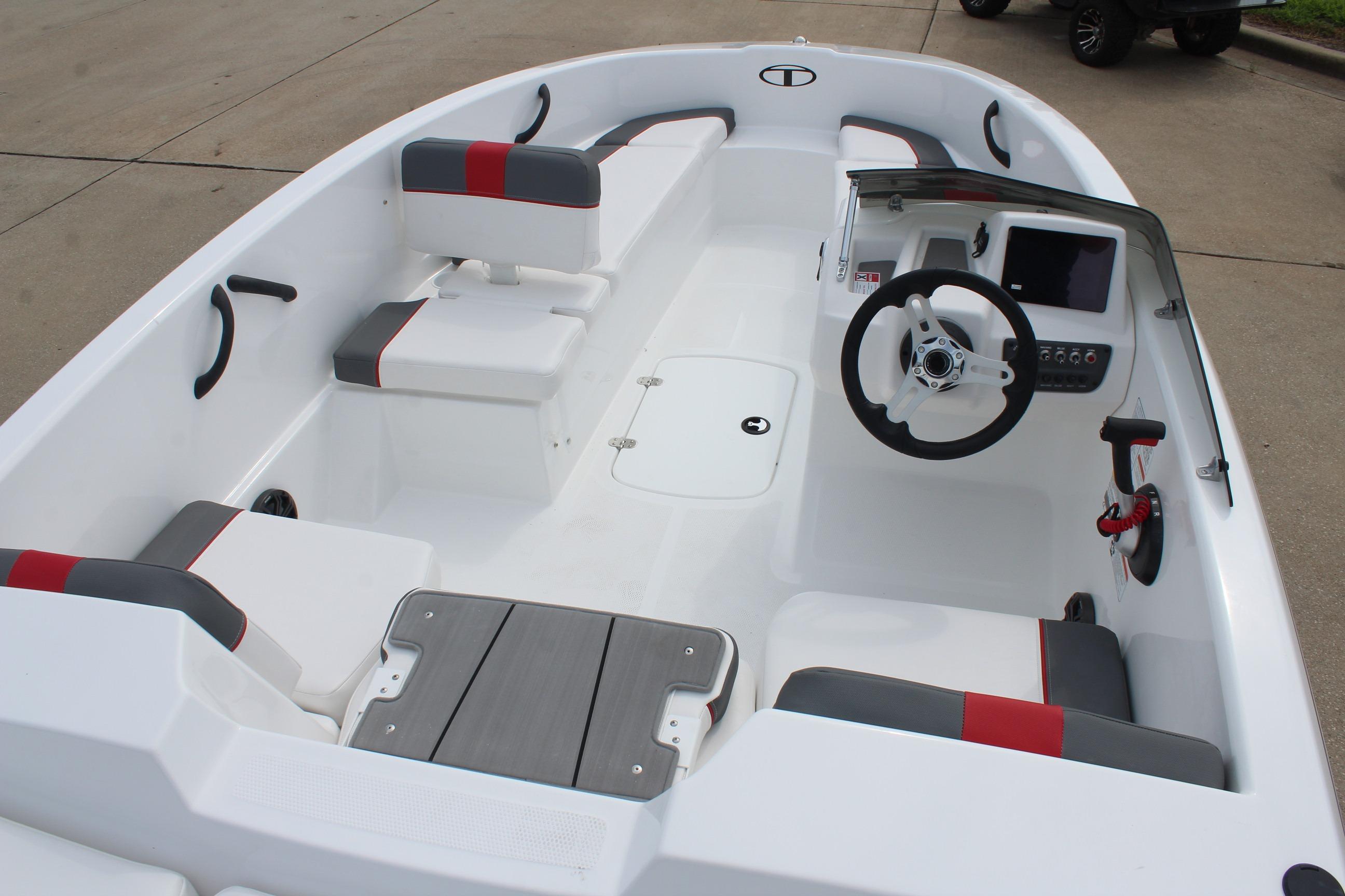 2026 Tahoe T16 boat interior with seating, steering wheel, and control panel.