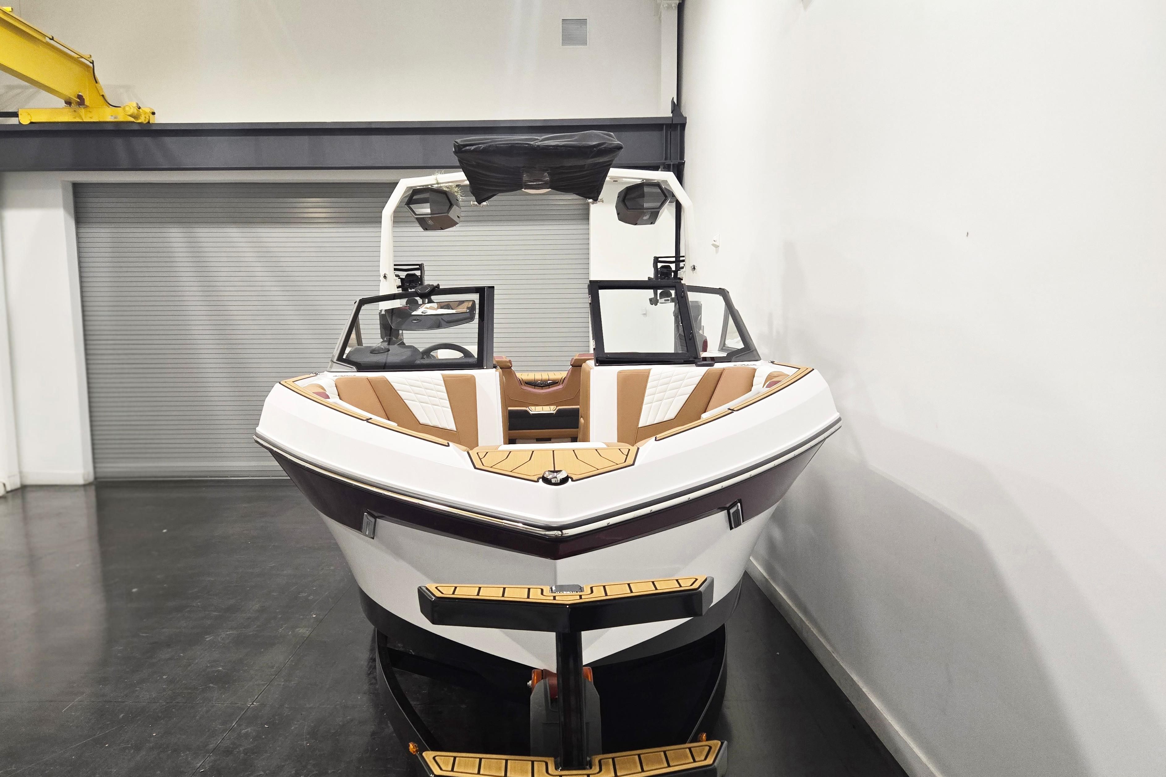 2026 Nautique Super Air Nautique S23 boat in showroom, front view.