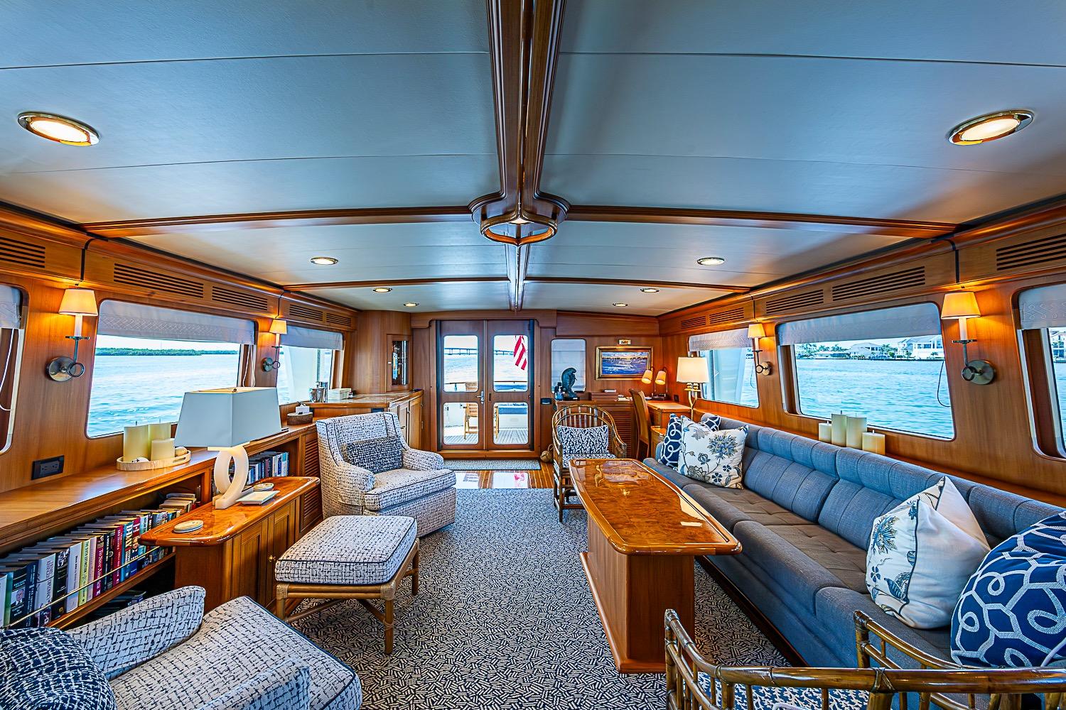 Luxurious interior of 2014 Marlow 80 Explorer yacht with elegant seating and ocean views.