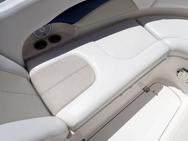 Luxurious seating on 2011 Chaparral 287 SSX boat, featuring sleek white upholstery.