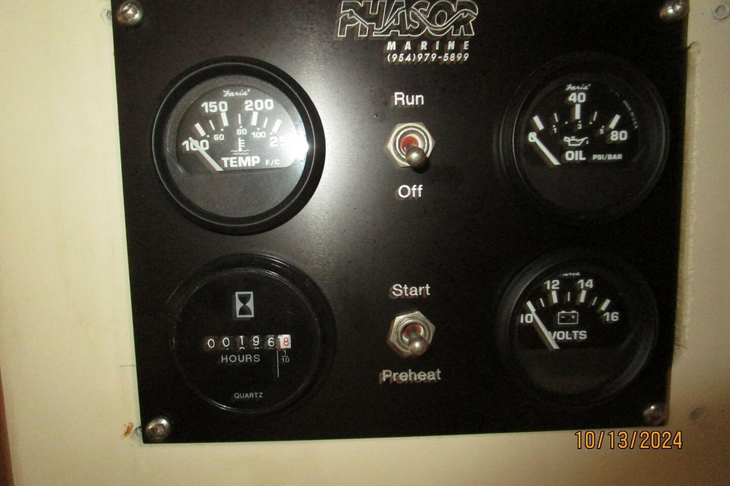 Control panel of a 1997 Rosborough Trawler with temperature, oil, and voltage gauges.