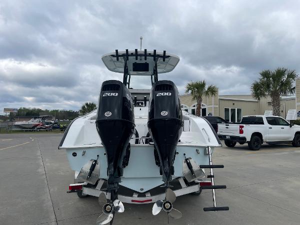 2026 Cape Horn 24XS boat with dual 200 horsepower engines, parked outdoors.