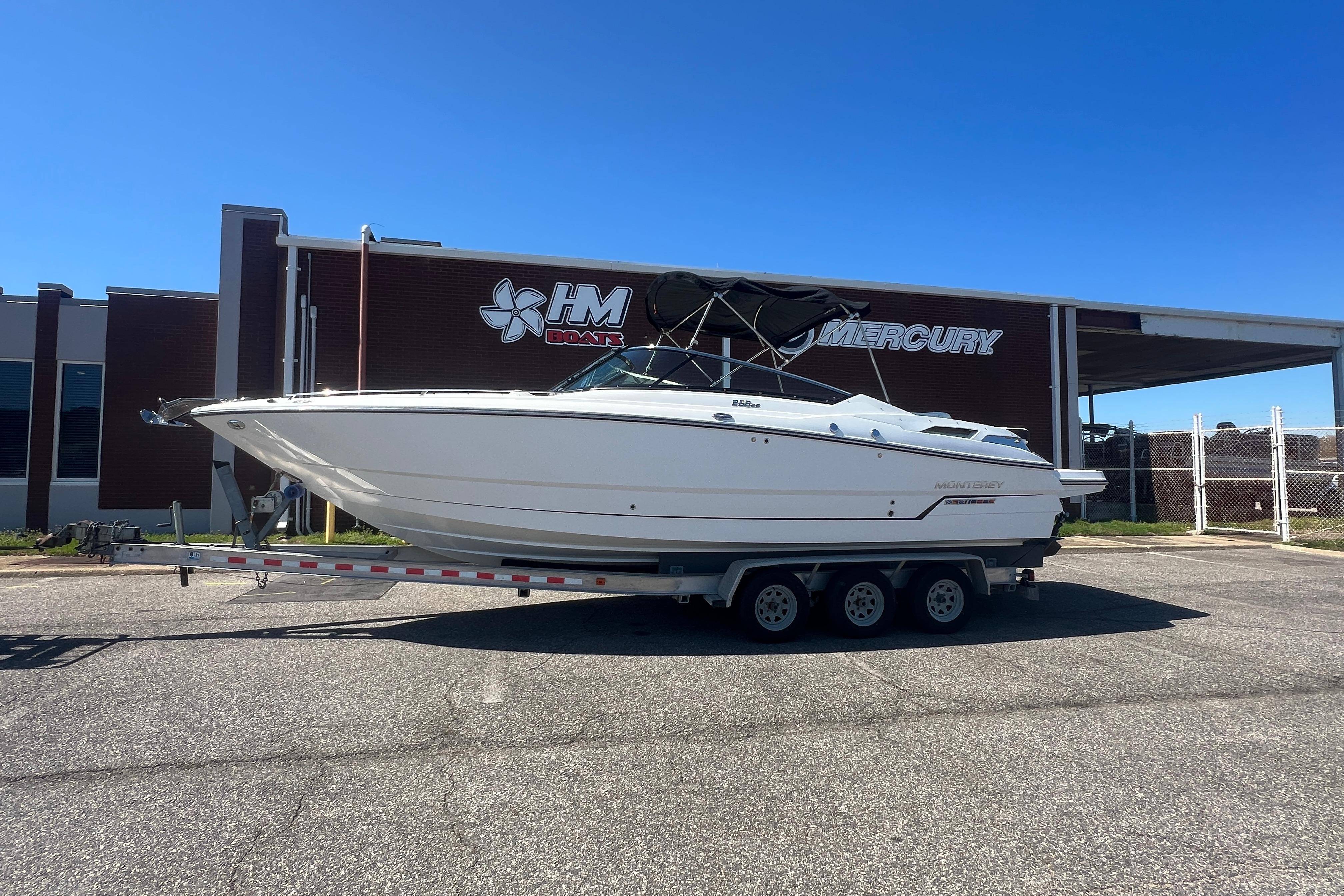 2017 Monterey 298SS Super Sport boat on trailer outside HM Boats dealership.