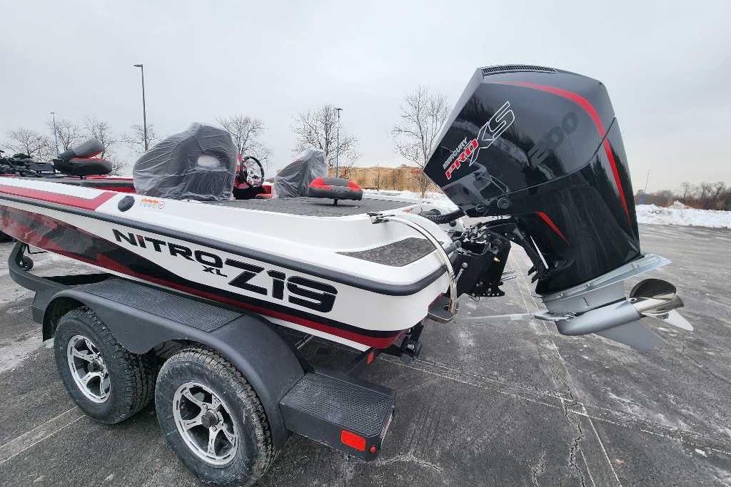 2026 Nitro Z19 XL Pro boat with powerful outboard motor on a trailer in snowy parking lot.