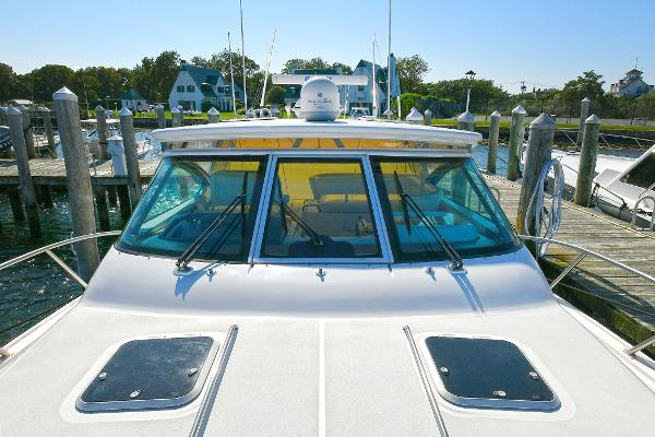 2008 Tiara Yachts 4200 Open docked at marina, showcasing sleek design and spacious deck.