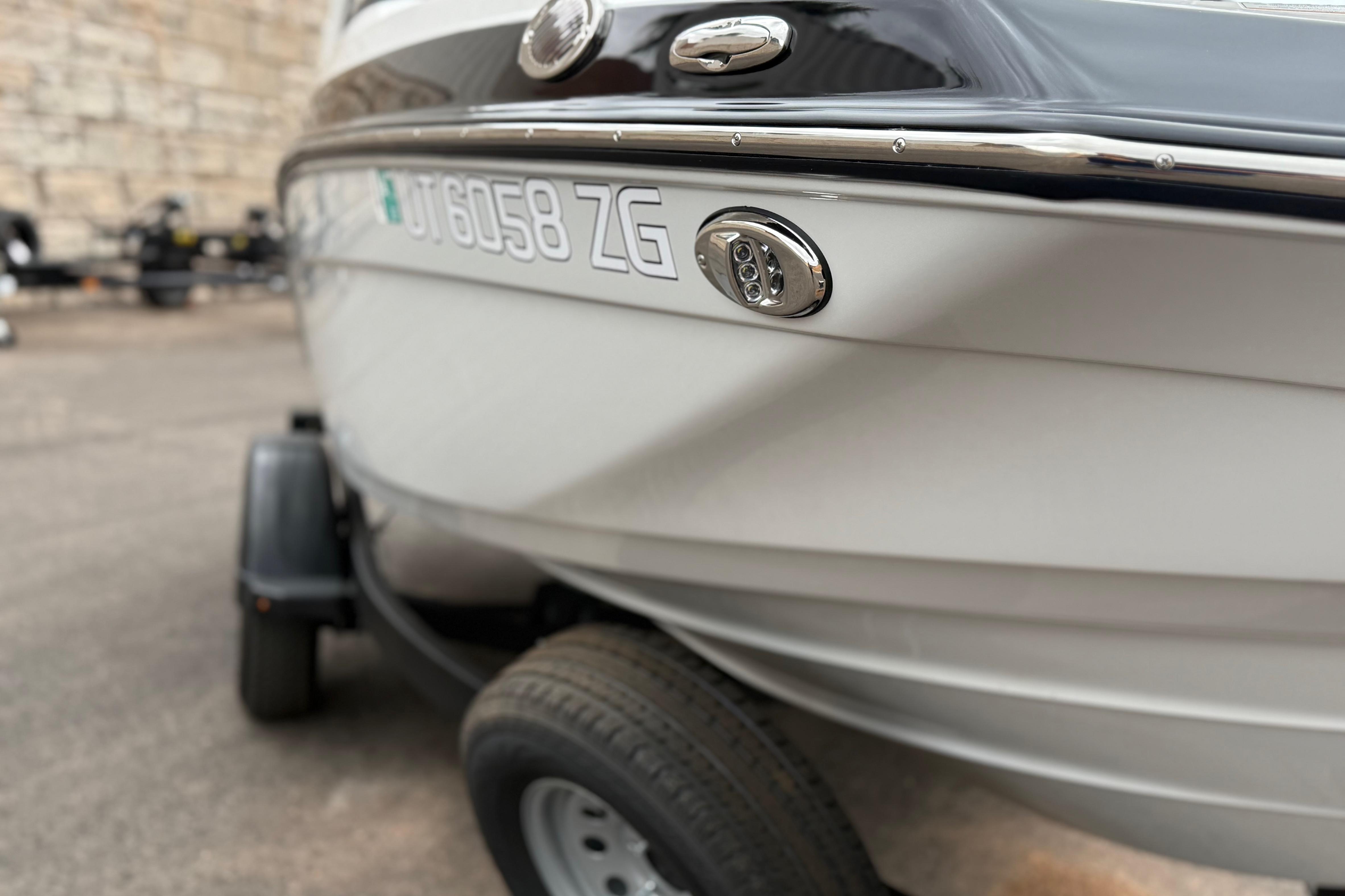 2025 Yamaha Boats 195S on trailer, close-up view of hull and registration number.