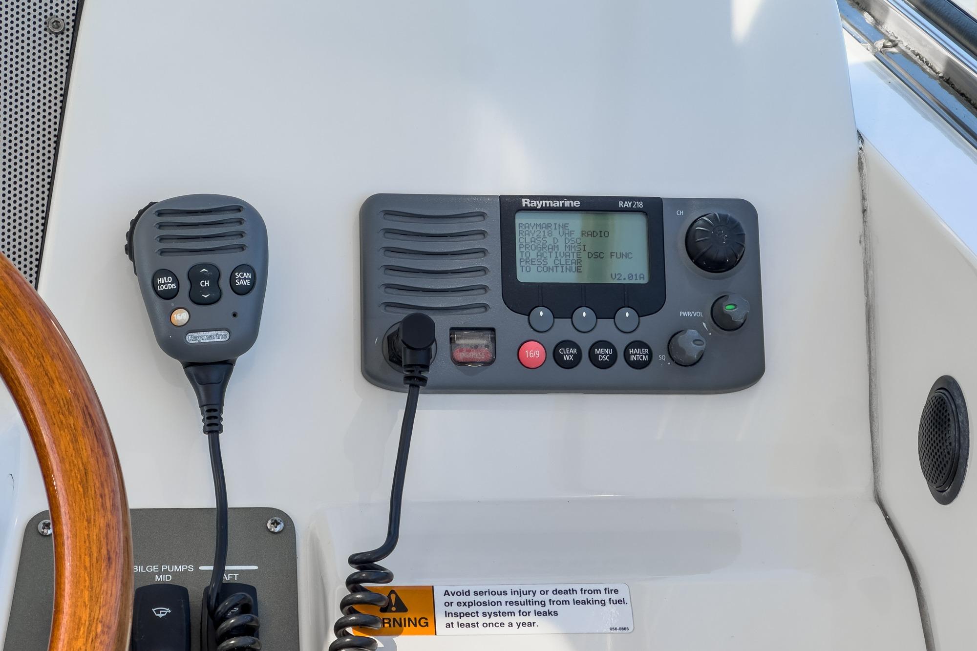 2007 Chris-Craft Roamer 40 control panel with Raymarine radio and microphone.