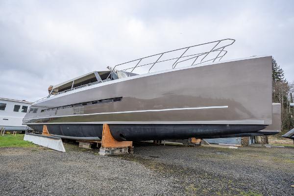 2025 Catamaran Bloomfield 86 Motorsailor on dry dock, sleek design, gray hull.