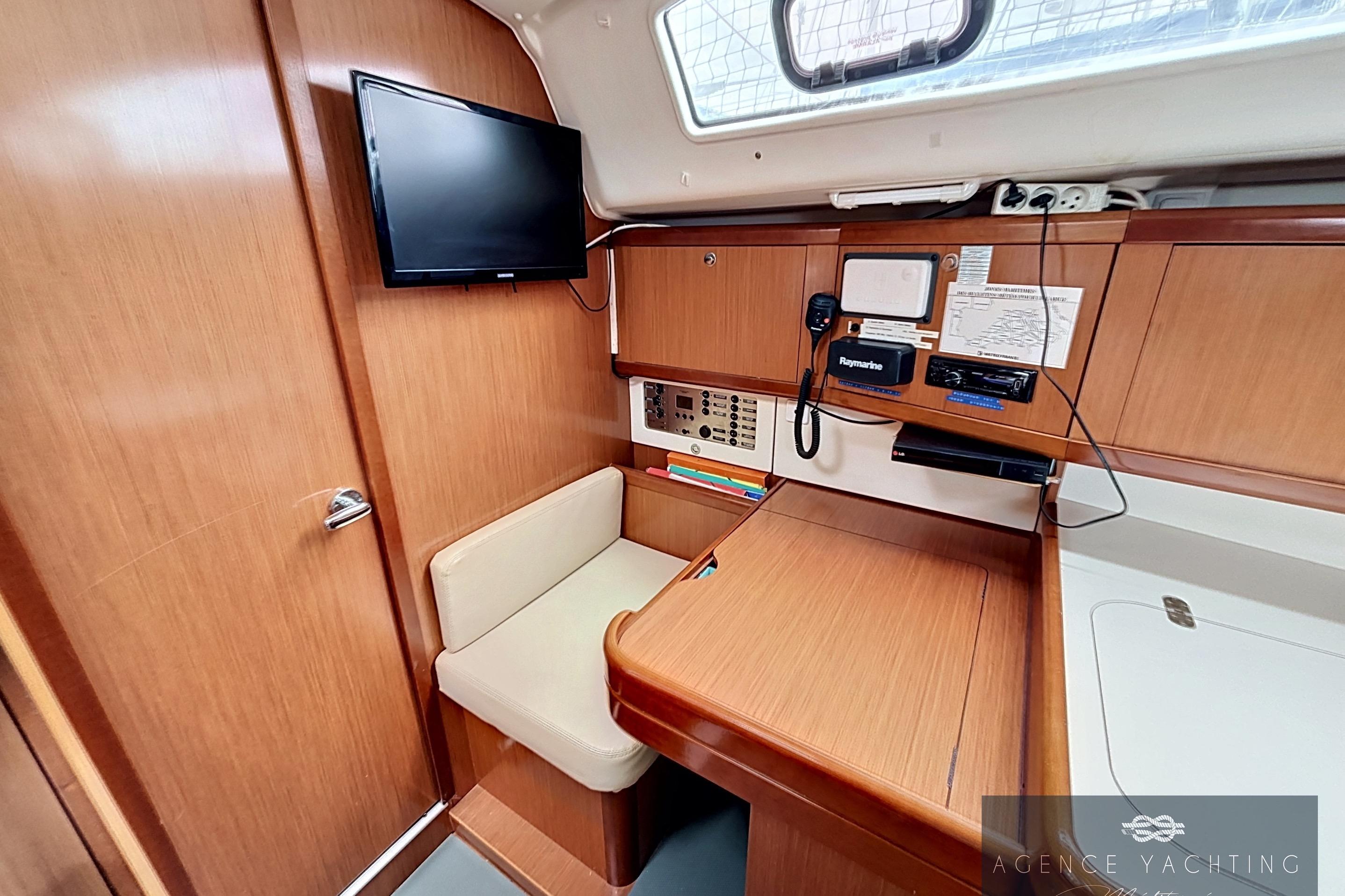 Interior of 2008 Beneteau Oceanis 40 yacht with navigation station and seating area.