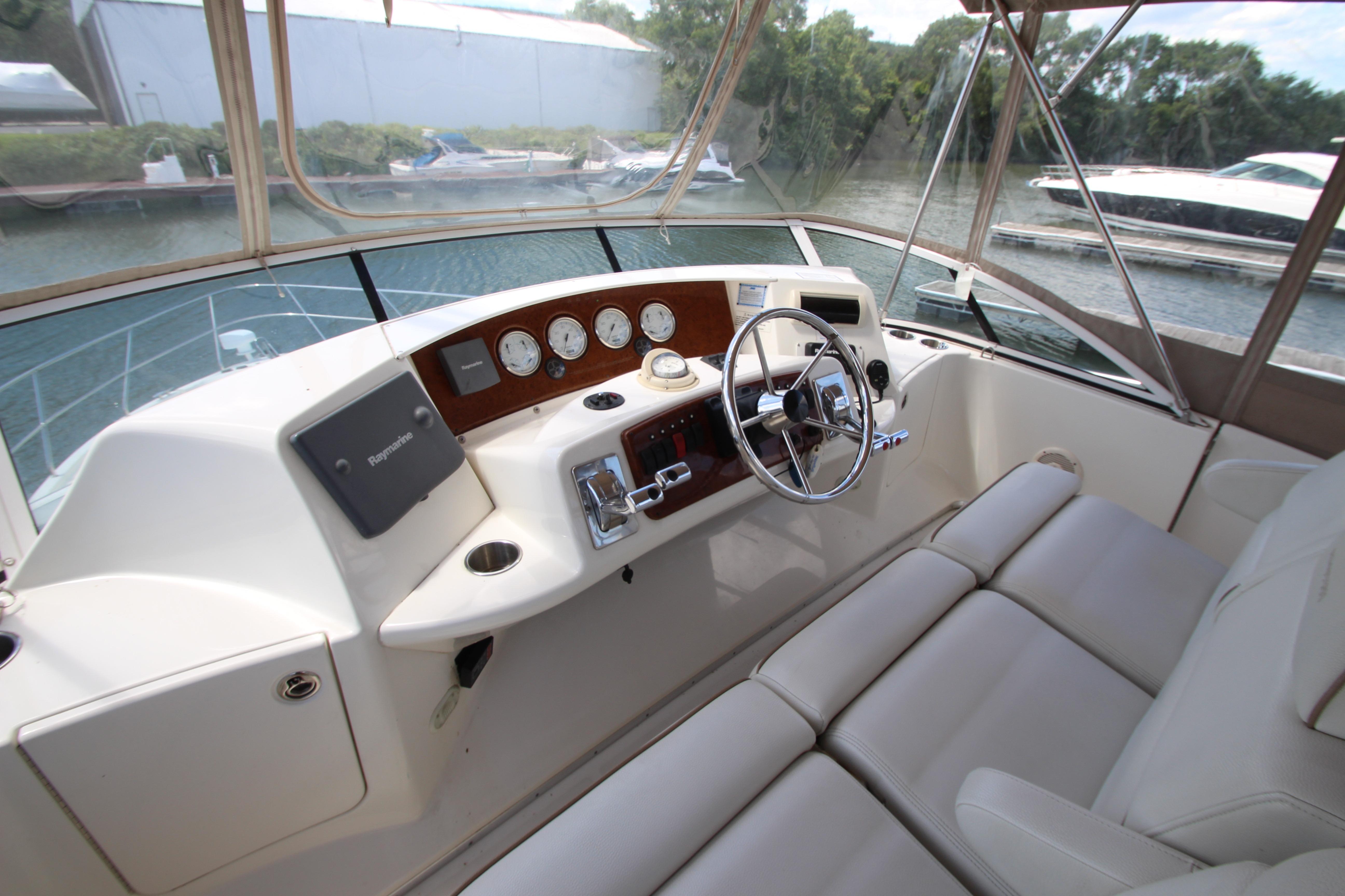 2006 Silverton 38 Sport Bridge helm with steering wheel and navigation instruments.