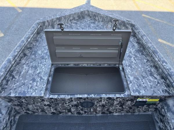 Open storage compartment on 2025 Havoc 1656 VJST boat with camo pattern.