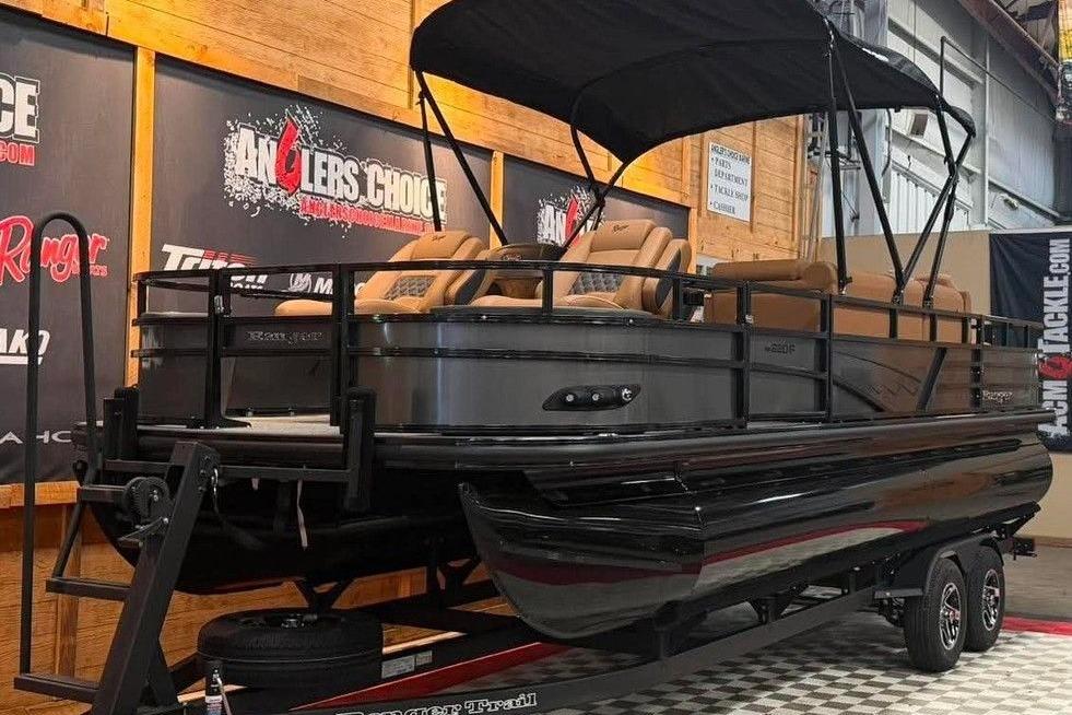 2026 Ranger 220F pontoon boat displayed indoors on a trailer.