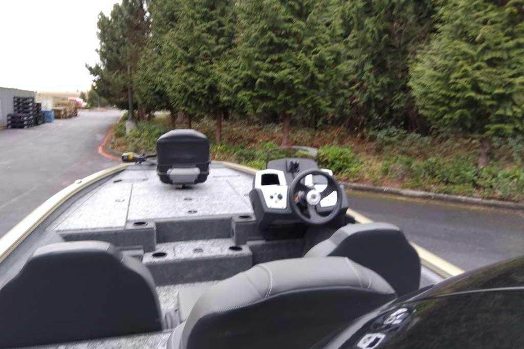 2026 Tracker Pro Team 195 boat interior with steering wheel, seats, and control panel.
