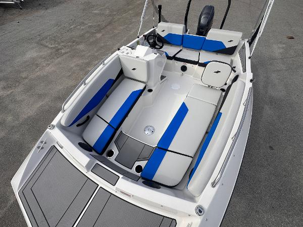 2025 Starcraft SV 16 OB boat with blue and white seating, sleek design.