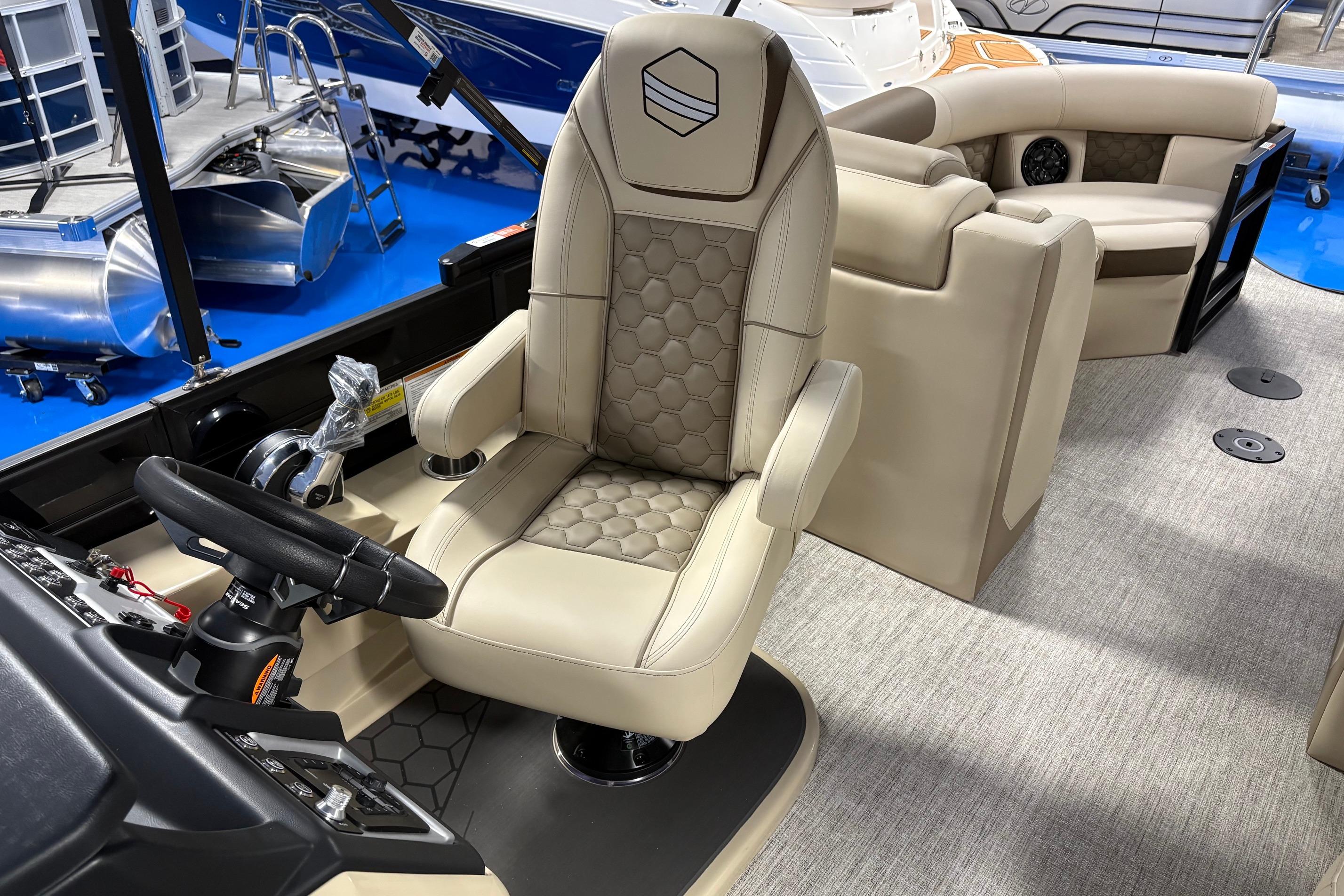 2026 South Bay 523RS boat interior with luxurious seating and modern steering console.