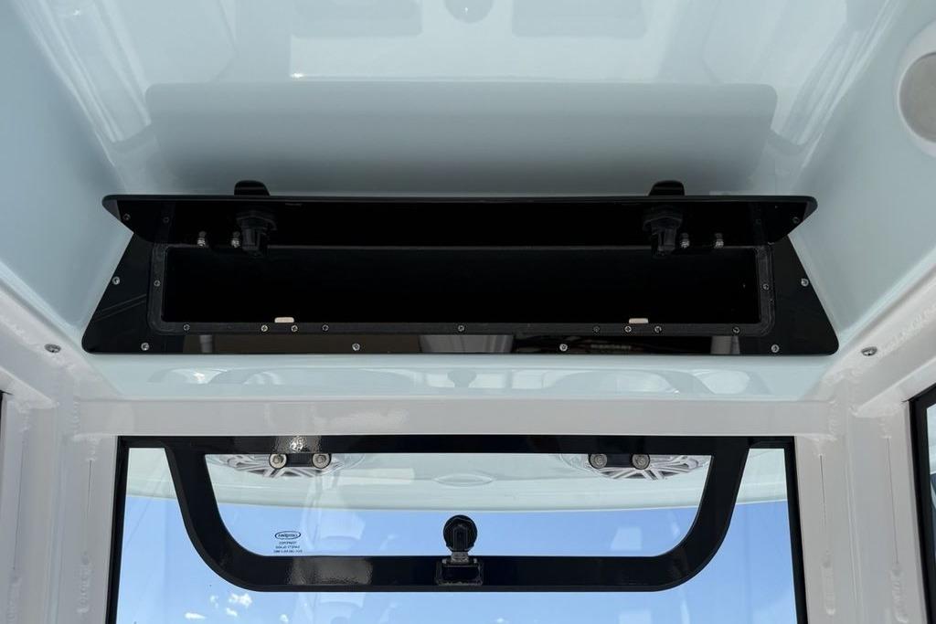 2026 Sportsman Open 232 Center Console interior view, featuring overhead storage compartment.