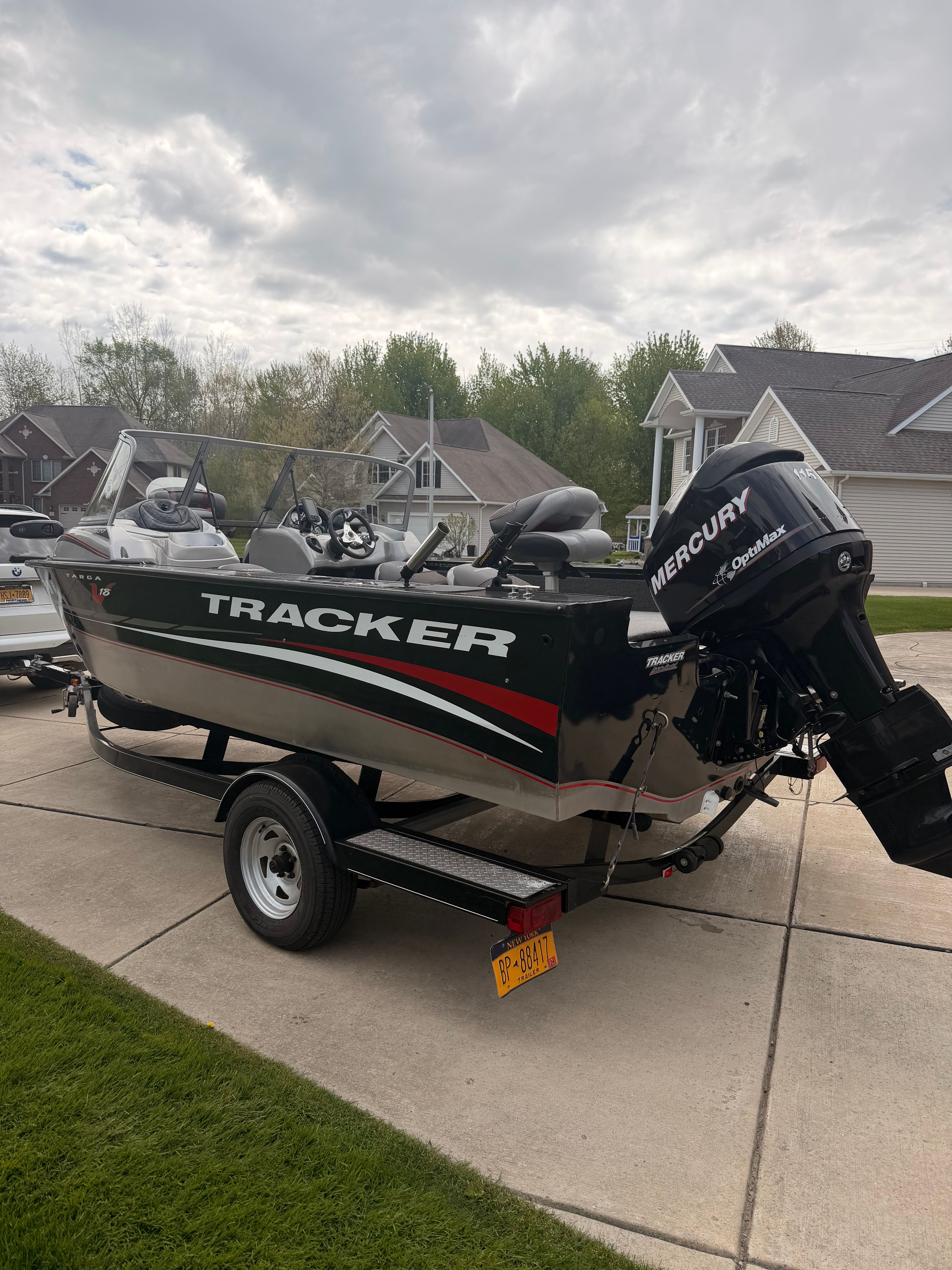 2013 Bass Tracker Targa V-18 WT on trailer in residential area.