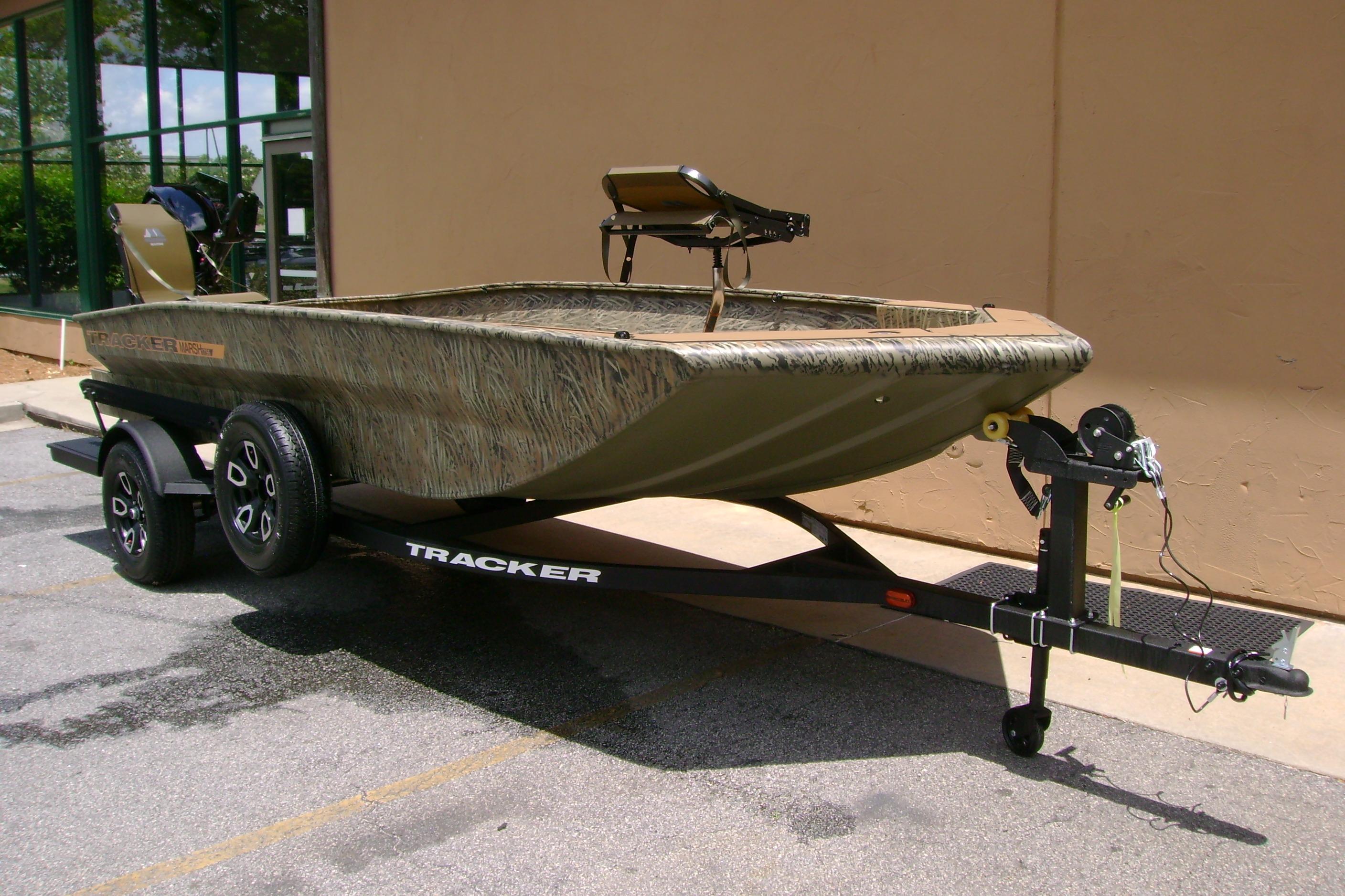 2026 Tracker Grizzly 1756 T Marsh boat on trailer, parked outdoors.