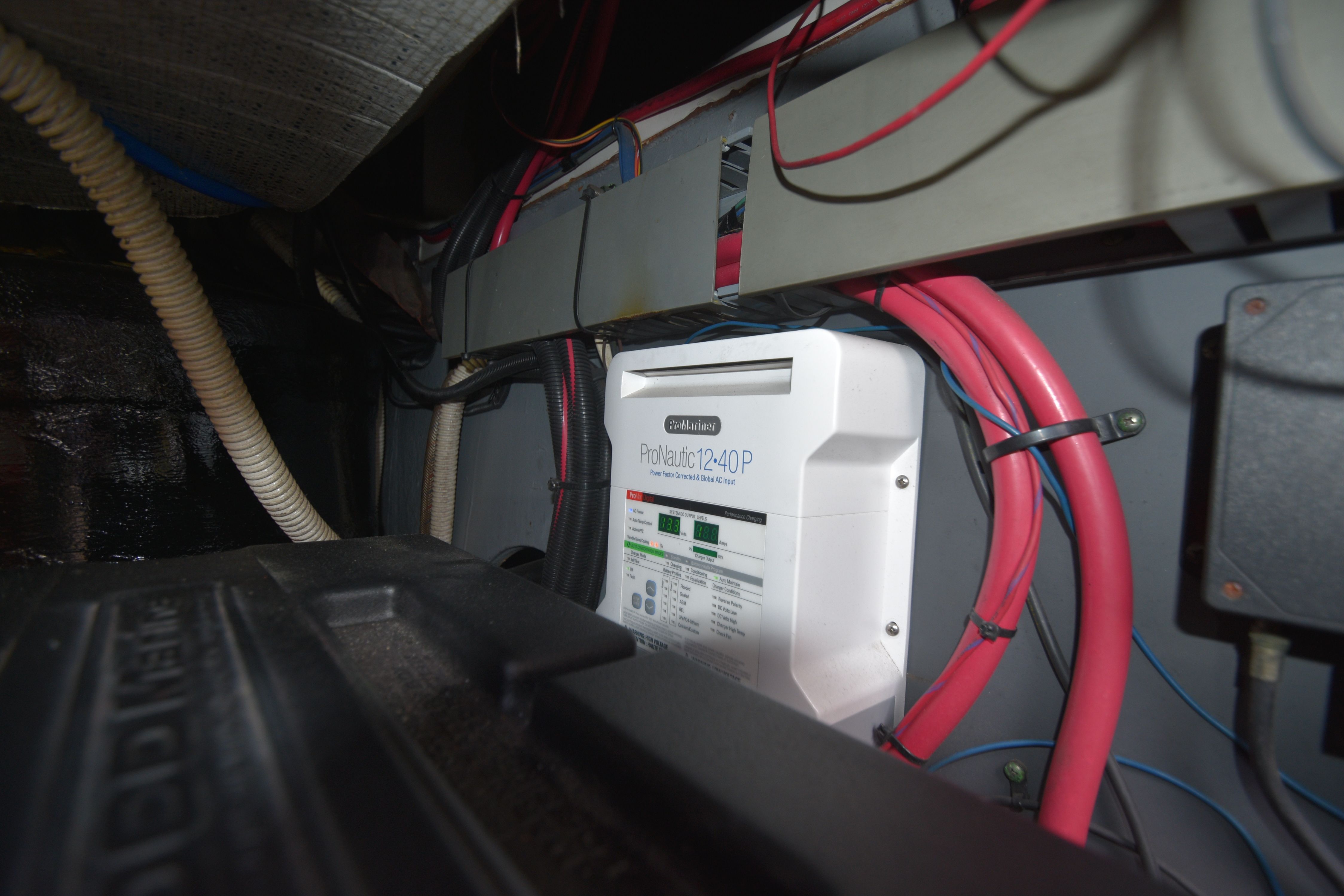 Electrical wiring and equipment in the engine room of a 2000 Sea Ray 480 Sedan Bridge.