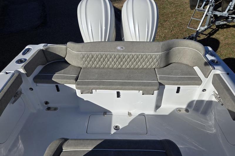 2026 Sea Hunt Ultra 275 Coffin Box boat interior with cushioned seating and storage compartments.