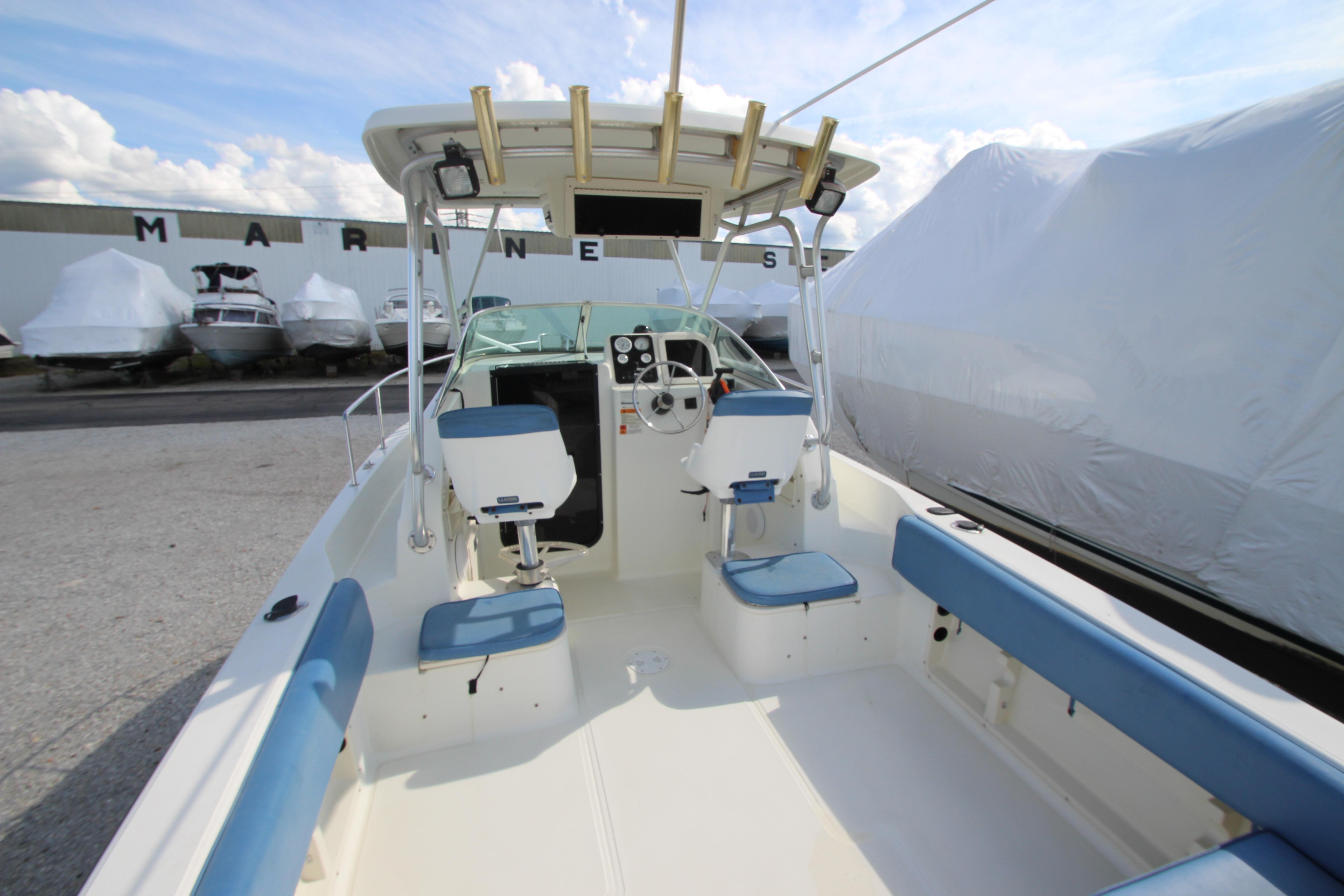 2002 Hydra-Sports 230 WA boat interior with blue seating and steering console.