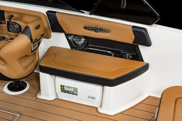 2024 Chaparral 28 Surf boat interior with tan and black seating.