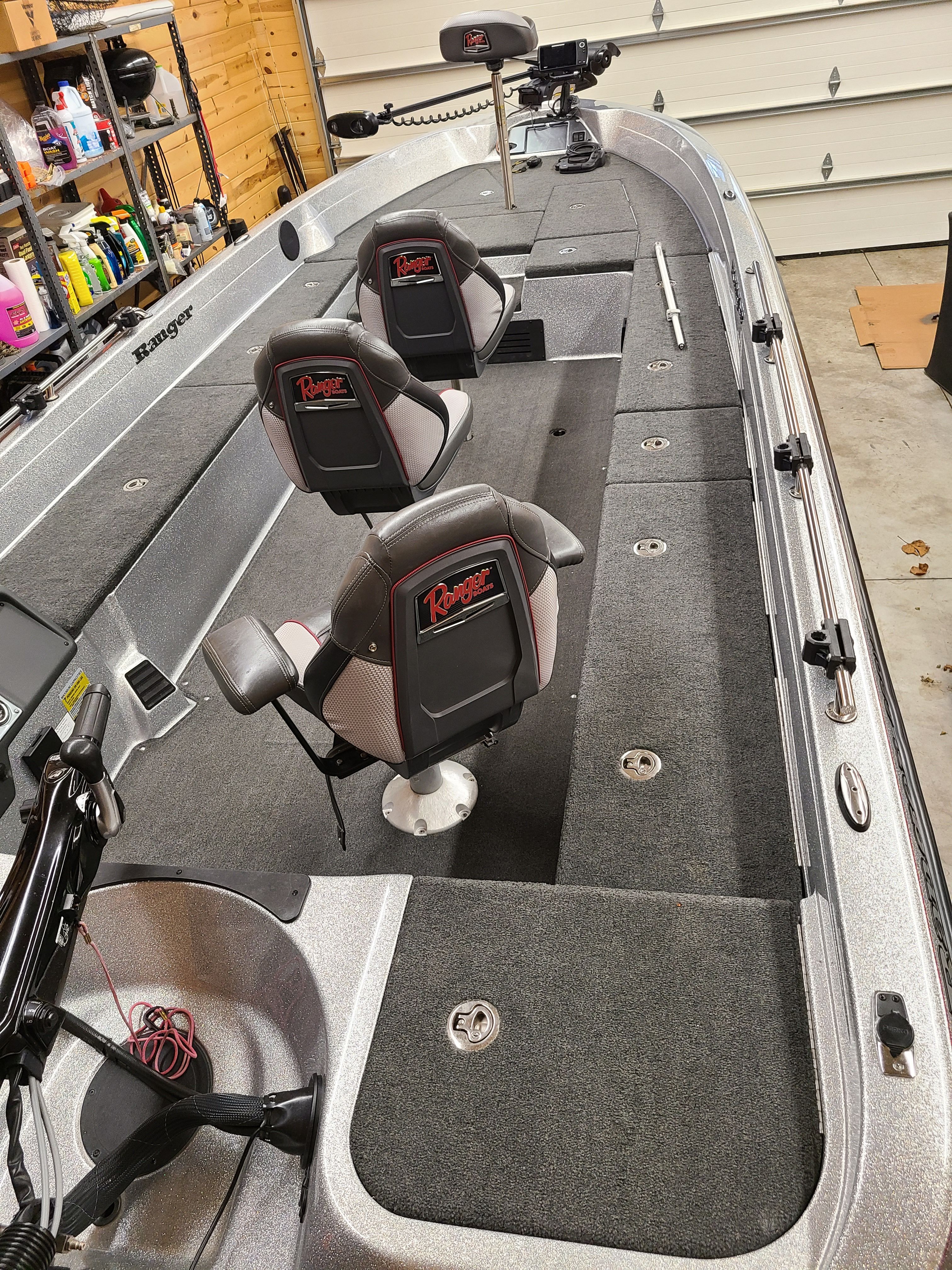 Interior view of a 2018 Ranger 620T Fisherman boat in a garage.