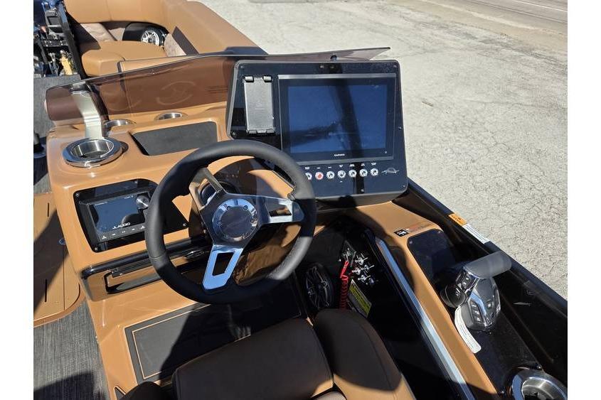 2026 SunCatcher Diamond Elite 326 SL boat dashboard with steering wheel and digital display.