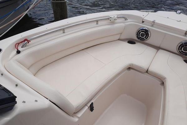 2016 Grady-White Freedom 205 boat interior with white seating and speakers.