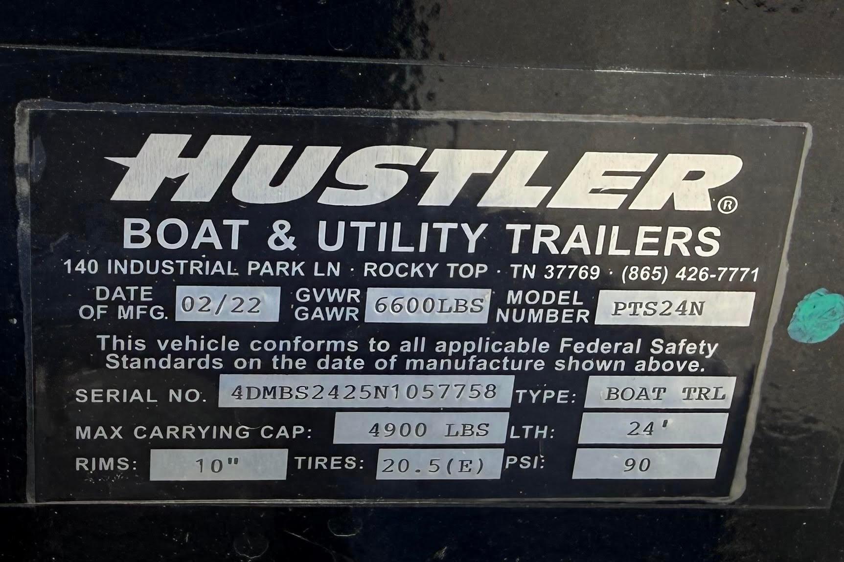 Label on Hustler boat trailer, model PTS24N, manufactured 02/22, GVWR 6600 lbs, 24' length.