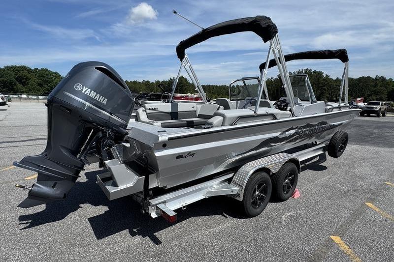 2025 SeaArk Super Lounge Easy boat with Yamaha motor on a trailer.