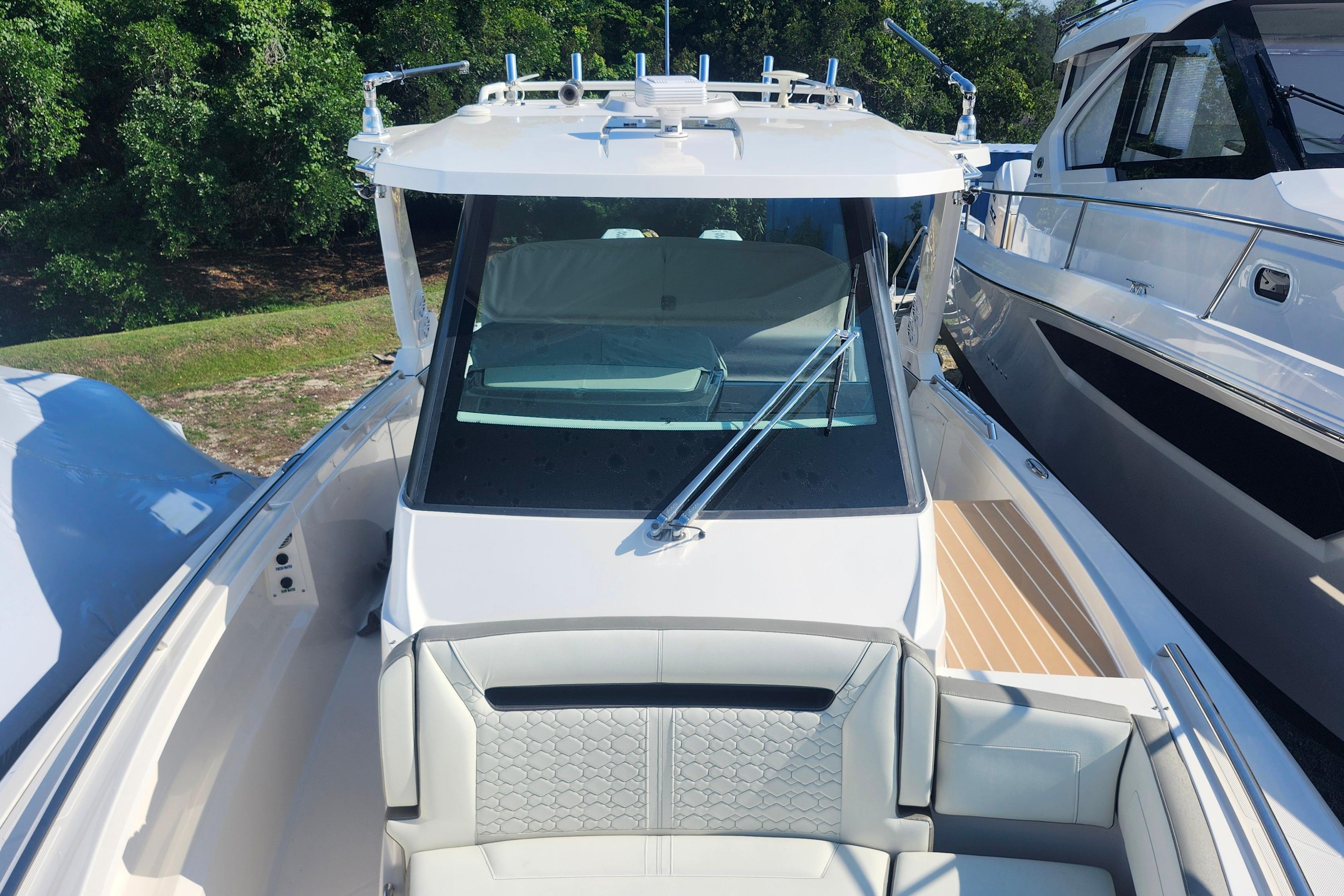 2024 Tiara Yachts 34 LS boat with sleek design and spacious seating area.