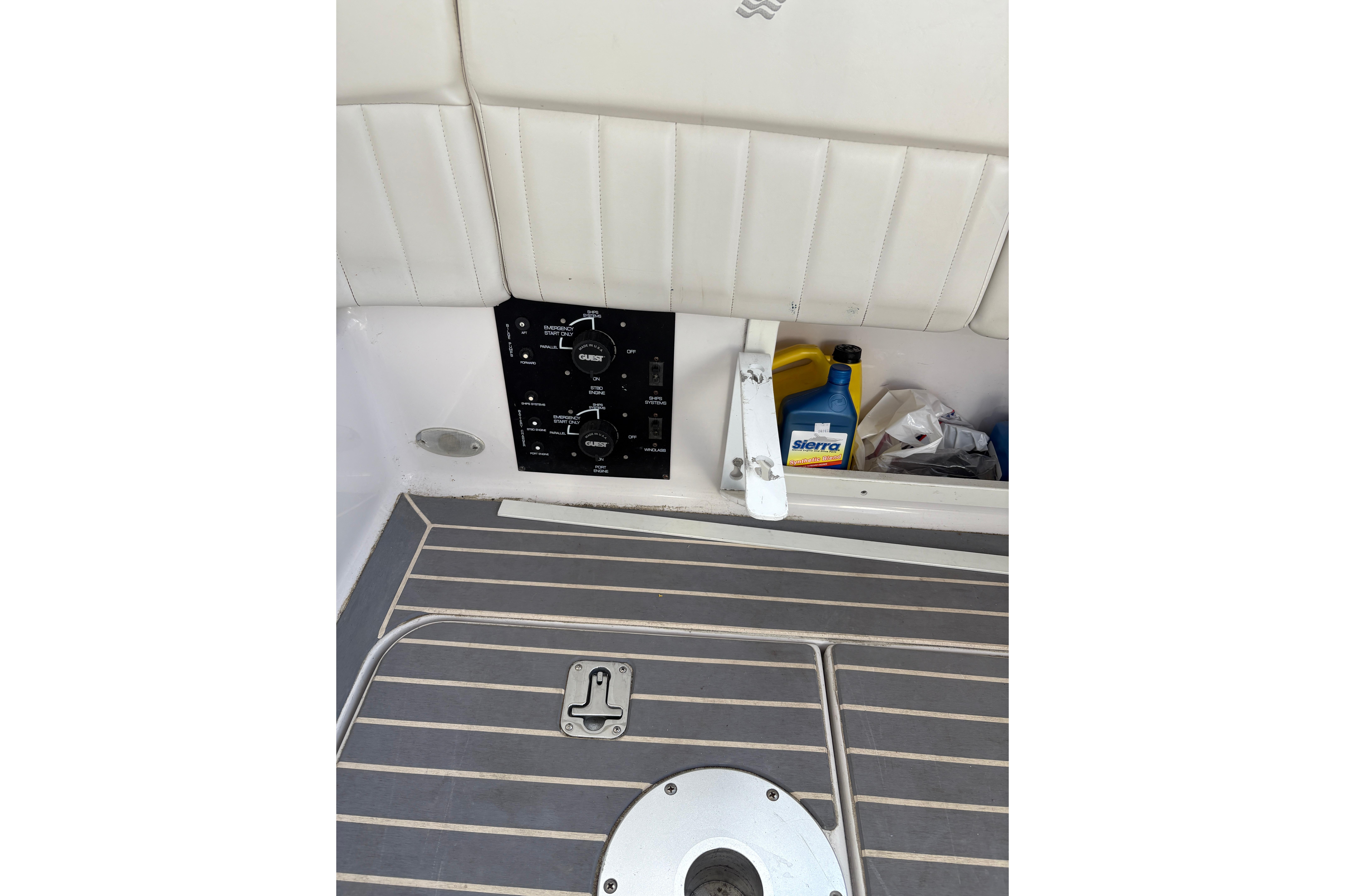 2002 Four Winns 328 Vista boat interior with control panel and storage compartment.