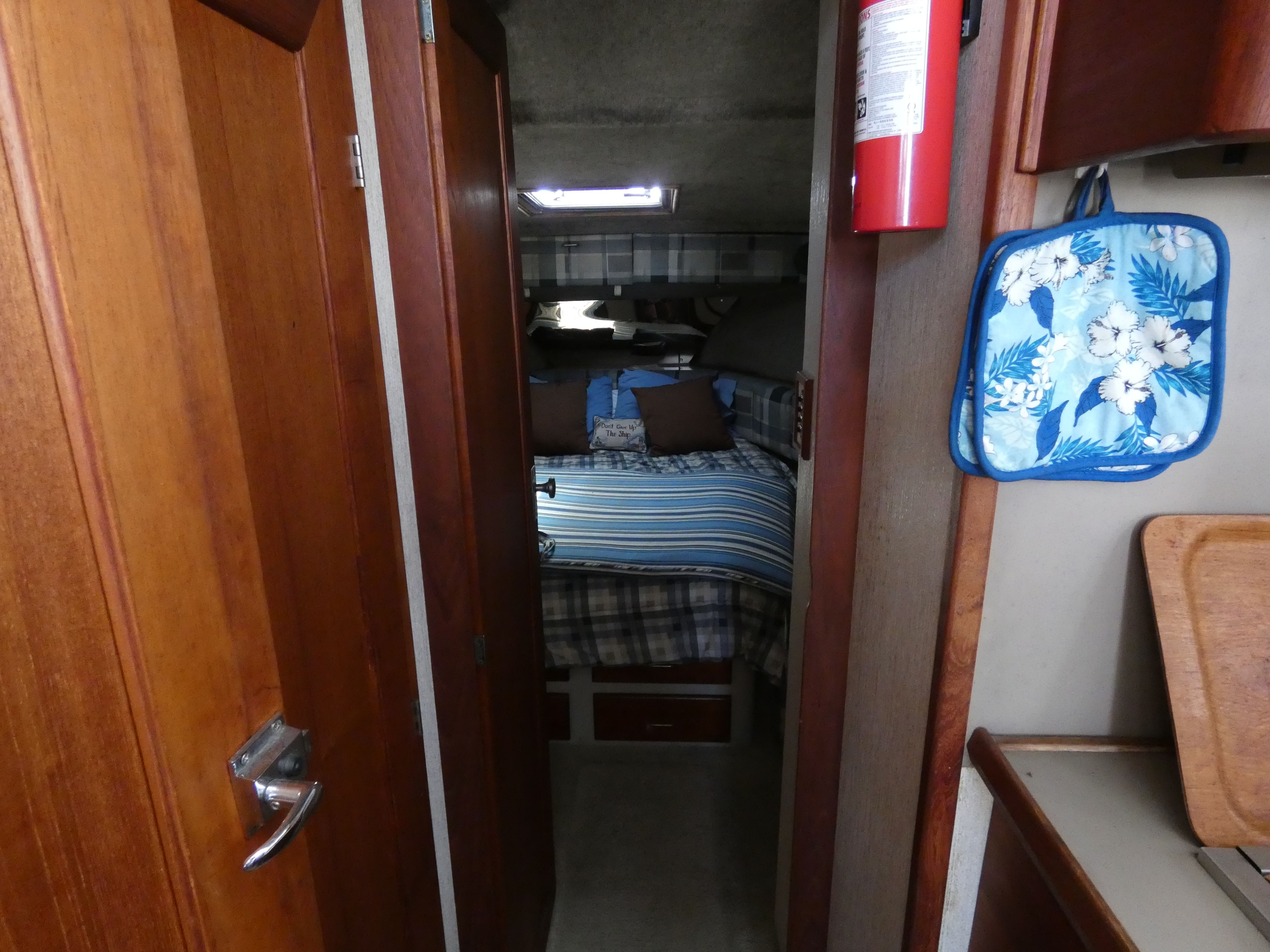 Interior of 1984 Bayliner 3870 Motoryacht featuring cozy bedroom.