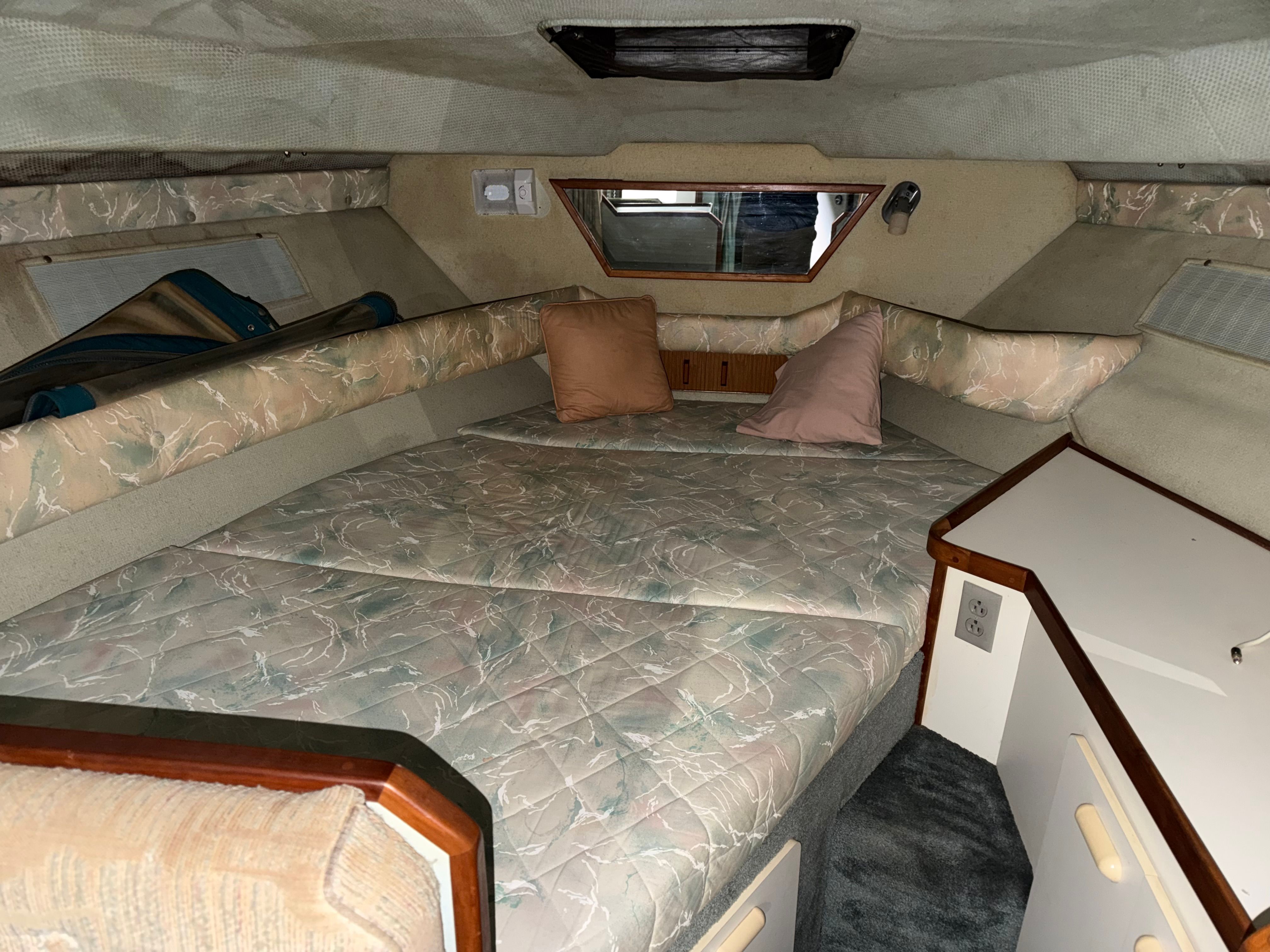 Interior of 1989 Sea Ray 300 Sundancer with sleeping area.