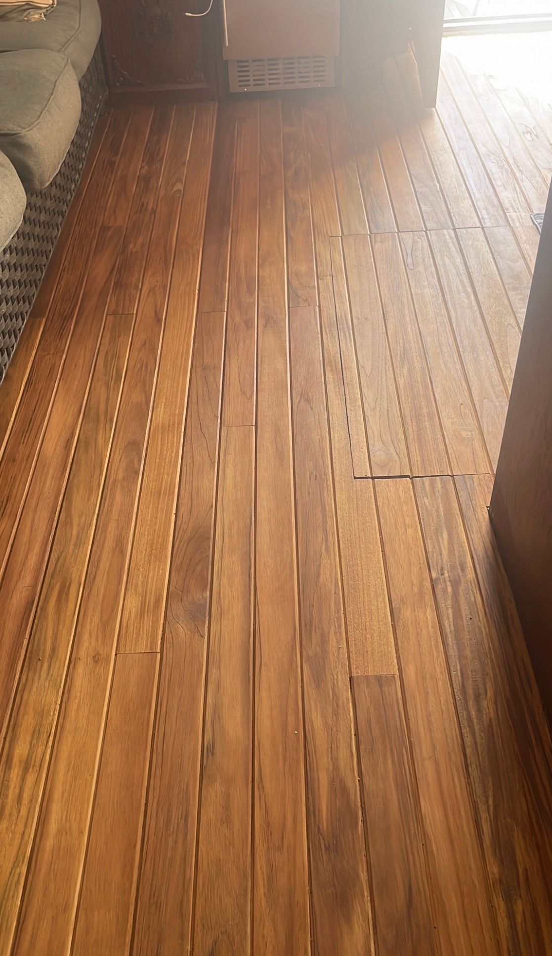 Wooden flooring inside a 1979 Hatteras sport fishing yacht.