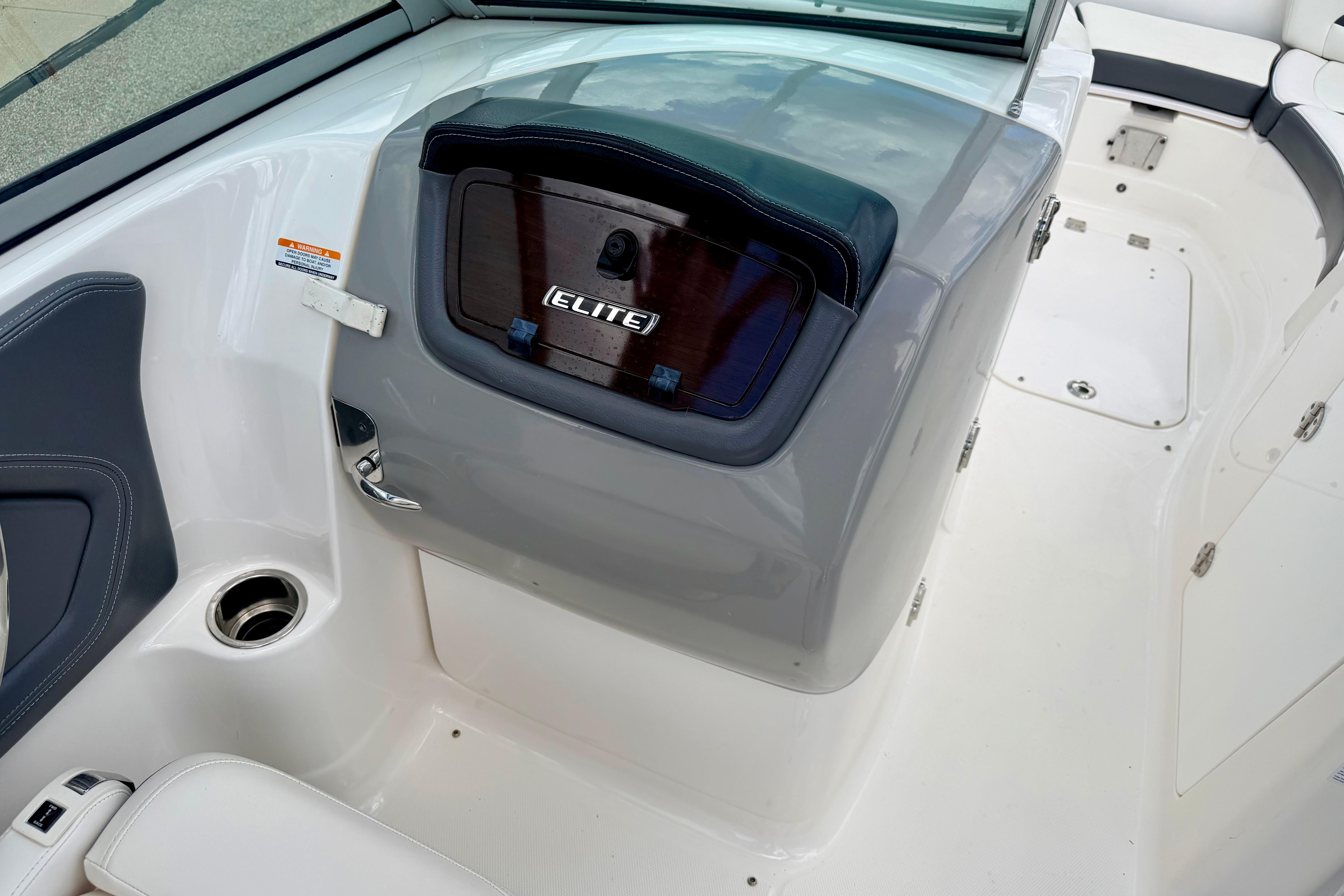 2015 Chaparral Sunesta 264 boat interior with Elite dashboard and seating area.