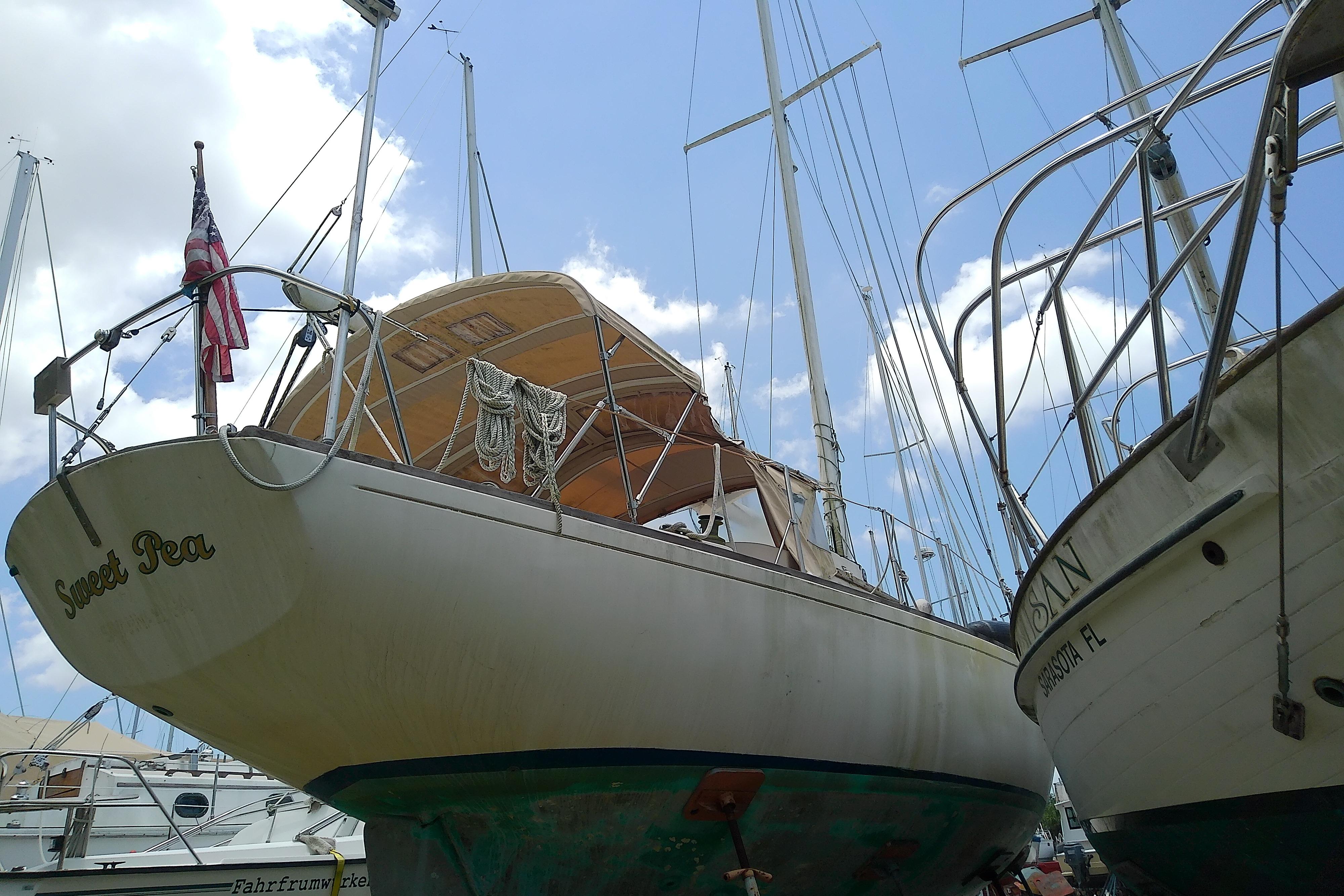 1981 Sea Sprite 34 sailboat "Sweet Pea" docked, with clear blue sky background.