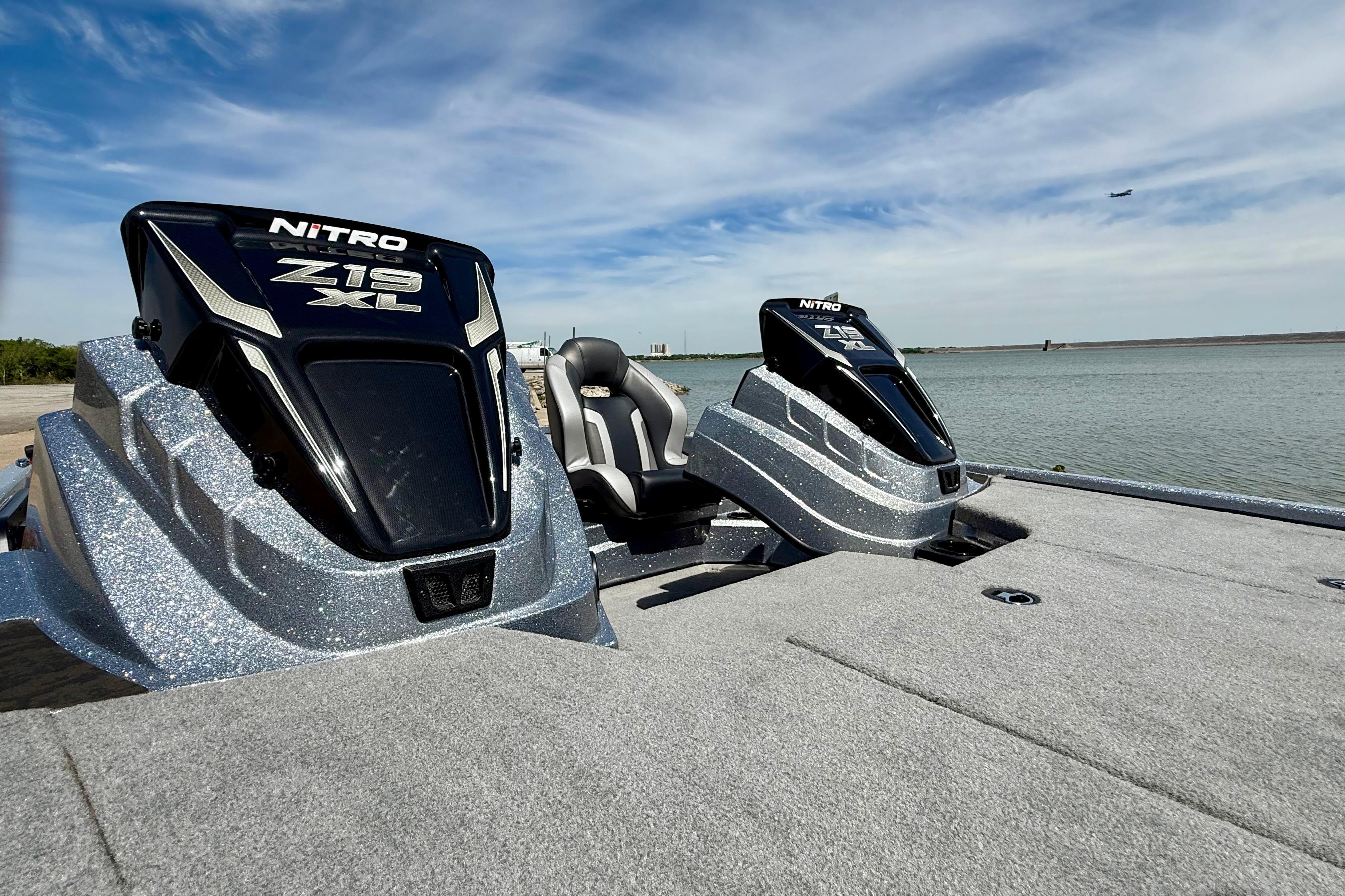 2026 Nitro Z19 XL boat on a lake with sleek design and modern features.